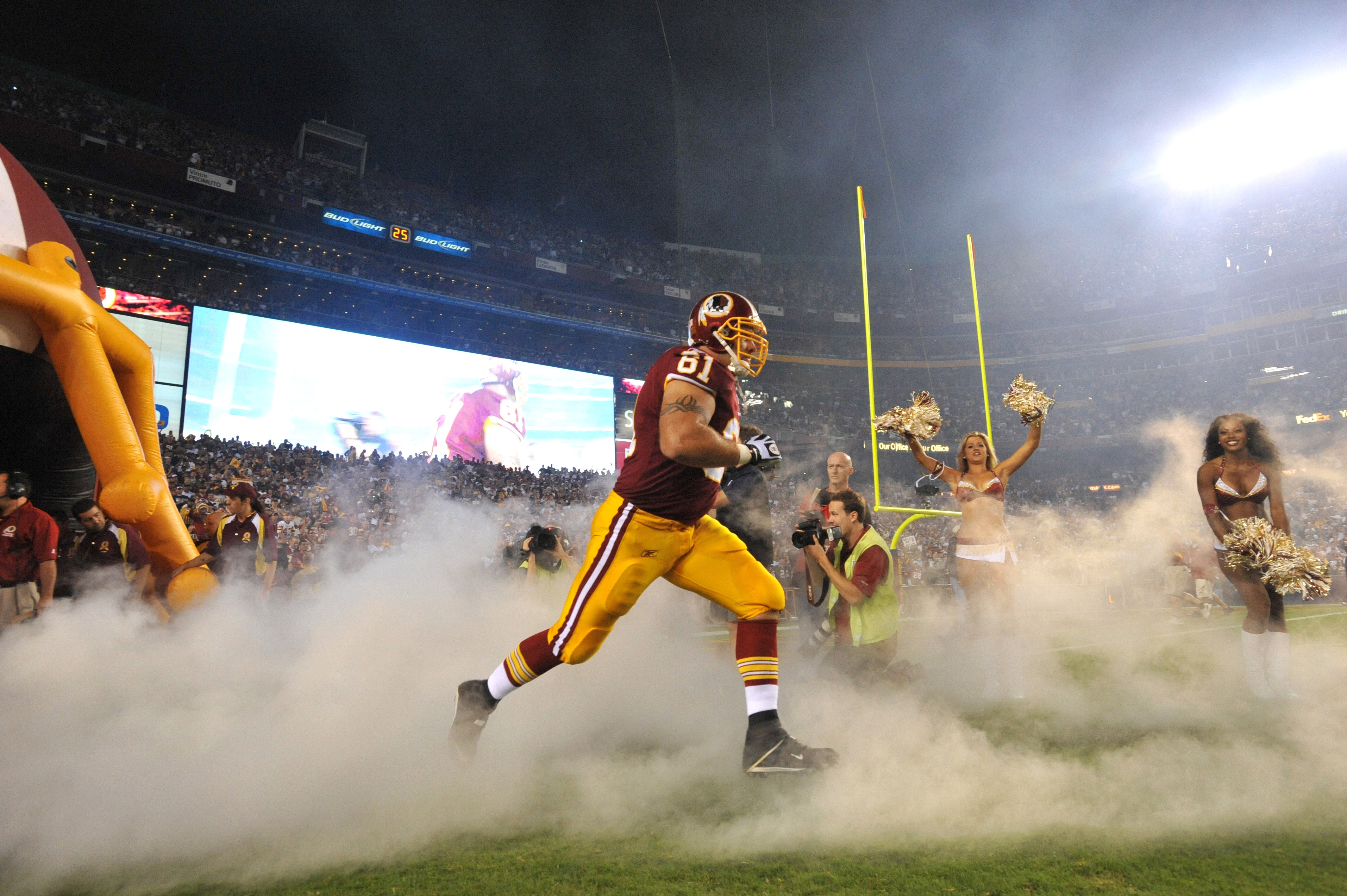 LANDOVER - SEPTEMBER 12:  Casey Rabach #61 of the Washington Redskins takes the field before the NFL season opener against the Dallas Cowboys at FedExField on September 12, 2010 in Landover, Maryland. The Redskins defeated the Cowboys 13-7. (Photo by Larr