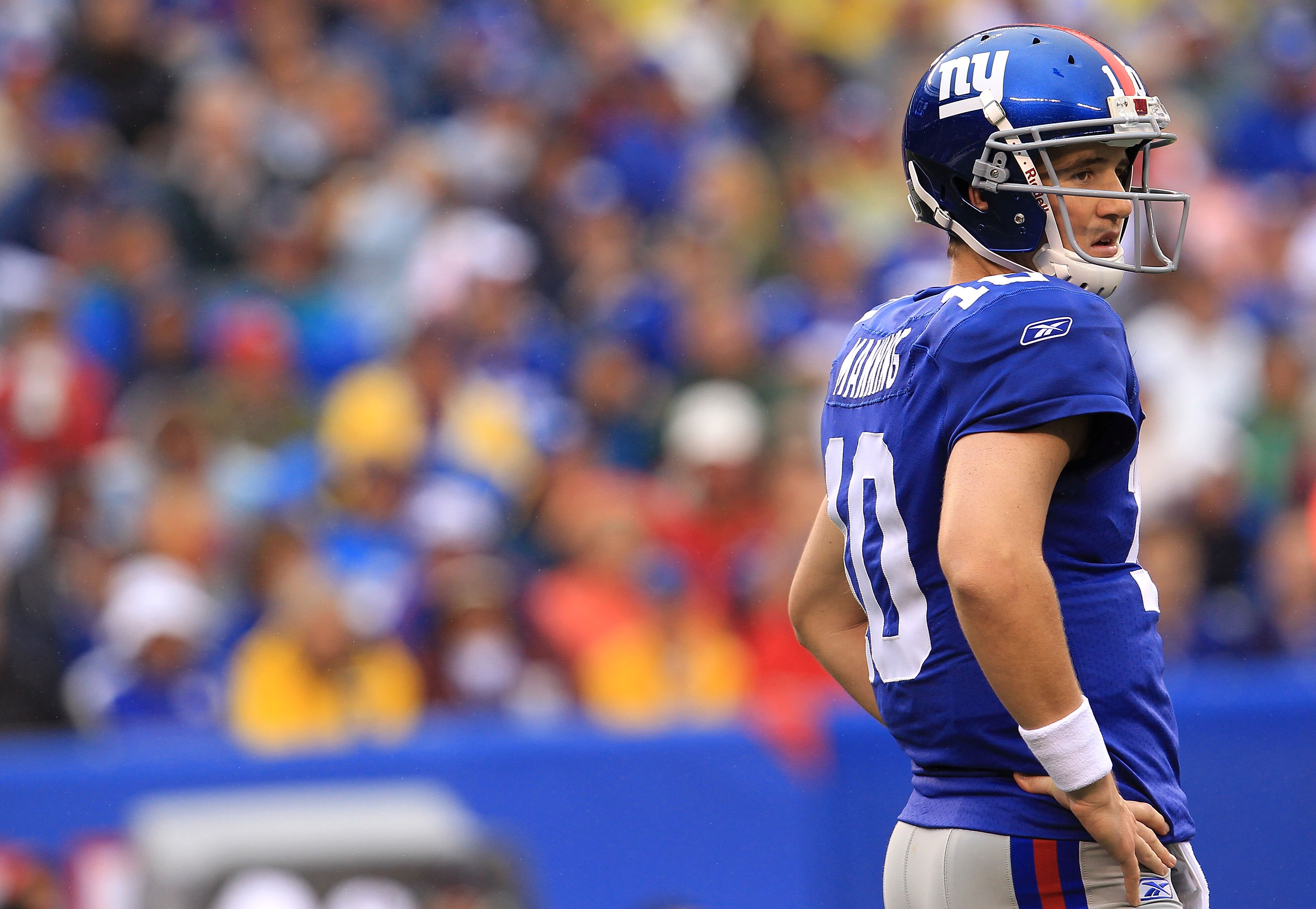 EAST RUTHERFORD, NJ - SEPTEMBER 12:  Eli Manning #10 of the New York Giants waits for instructions against the Carolina Panthers during the NFL season opener at New Meadowlands Stadium on September 12, 2010 in East Rutherford, New Jersey.  (Photo by Chris