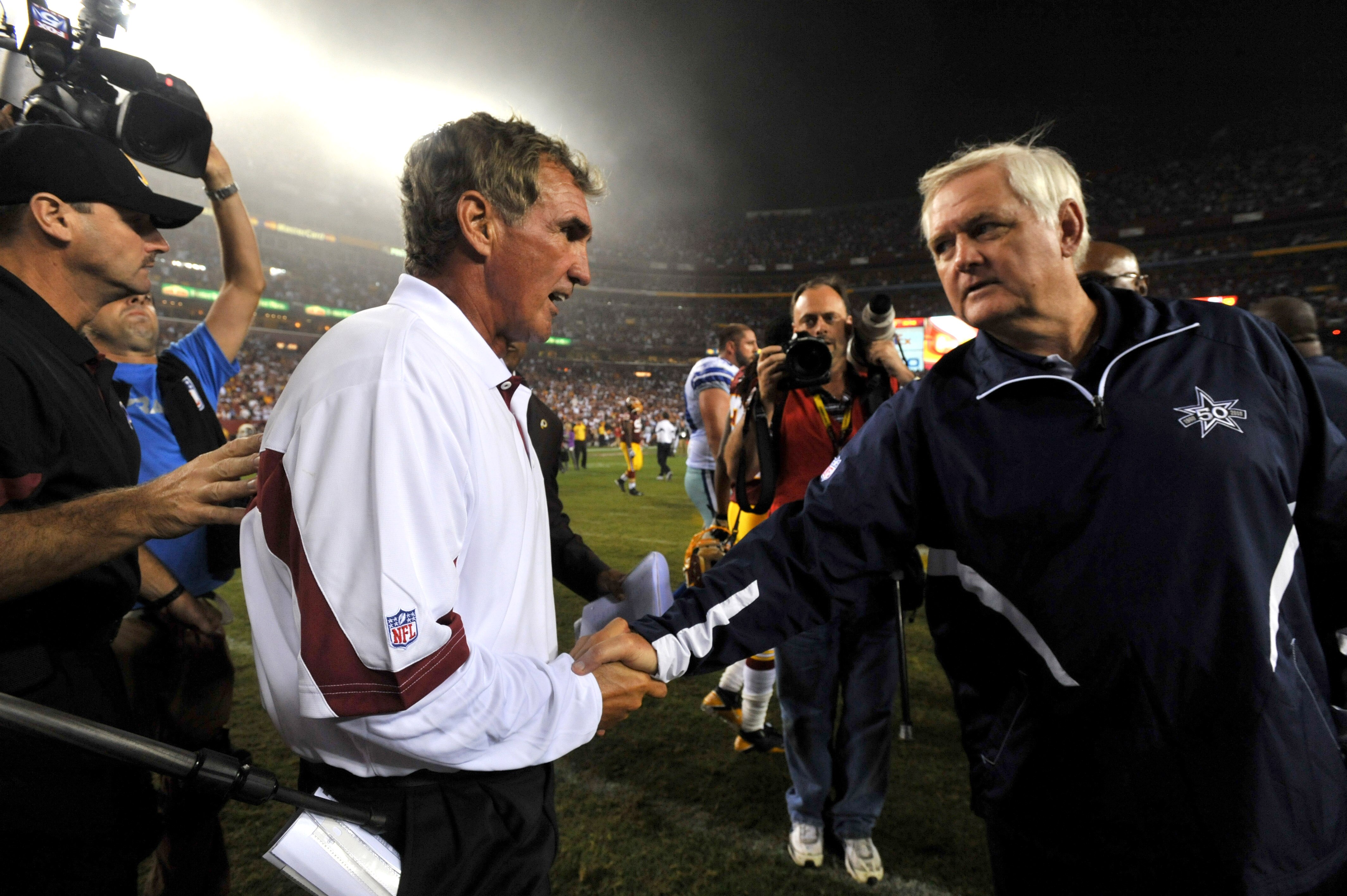 LANDOVER - SEPTEMBER 12:  Head coach Mike Shanahan of the Washington Redskins shakes hands with head coach Wade Phillips of the Dallas Cowboys after the NFL season opener against the Dallas Cowboys at FedExField on September 12, 2010 in Landover, Maryland