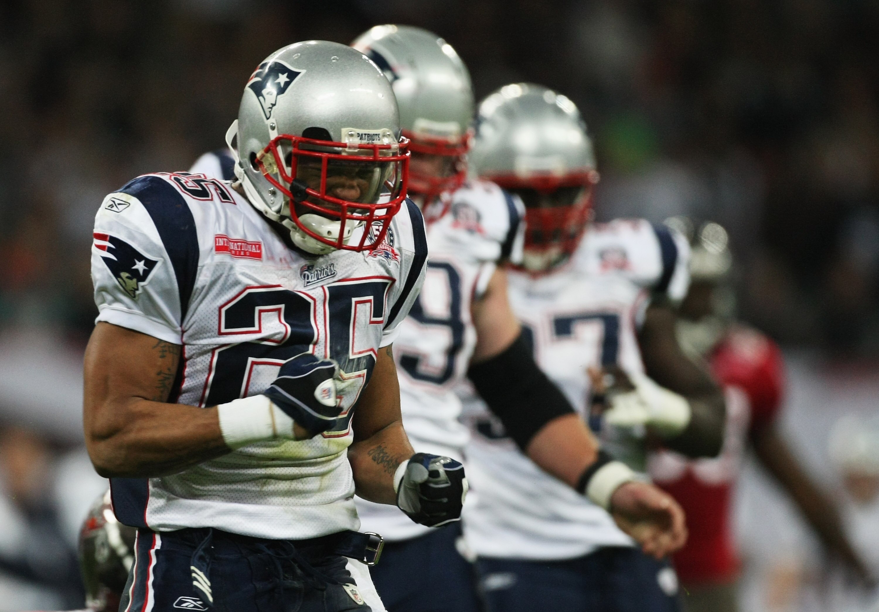 LONDON, ENGLAND - OCTOBER 25:  Pat Chung (#25) of the New England Patriots celebrates an intercept during the NFL International Series match between New England Patriots and Tampa Bay Buccaneers at Wembley Stadium on October 25, 2009 in London, England. T