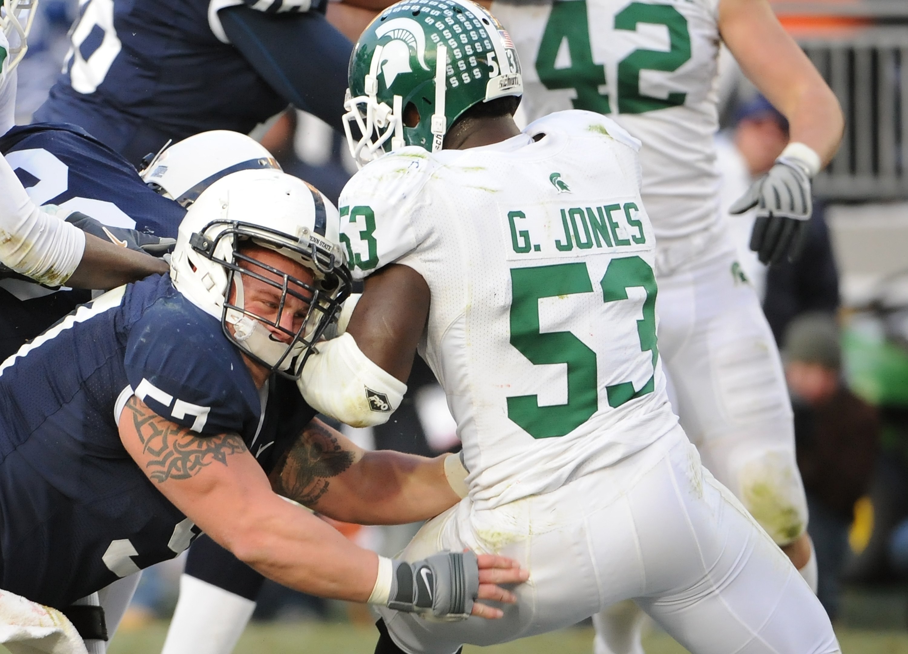 STATE COLLEGE - NOVEMBER 22:  A.Q. Shipley #57 of the Penn State Nittany Lions blocks Greg Jones #53 of the Michigan State Spartans on November 22, 2008 at Beaver Stadium in State College, Pennsylvania.  (Photo by Joe Sargent/Getty Images)