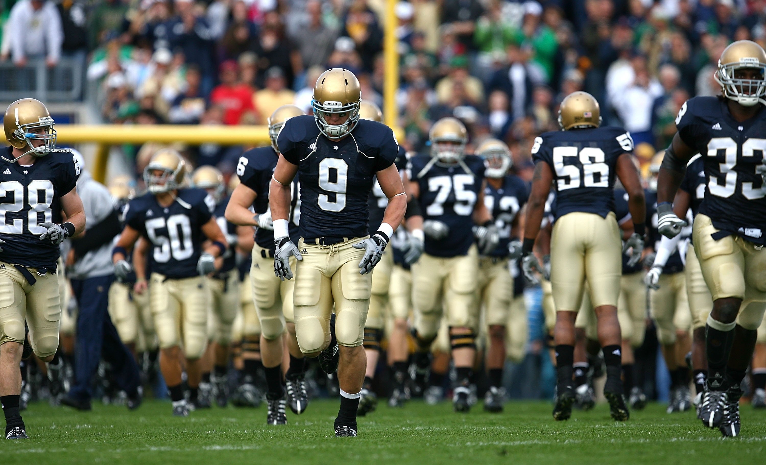 SOUTH BEND, IN - OCTOBER 03: Kyle Rudolph #9 of the Notre Dame Fighting Irish runs onto the field with teammates before a game against the Washington Huskies on October 3, 2009 at Notre Dame Stadium in South Bend, Indiana. Notre Dame defeated Washington 3