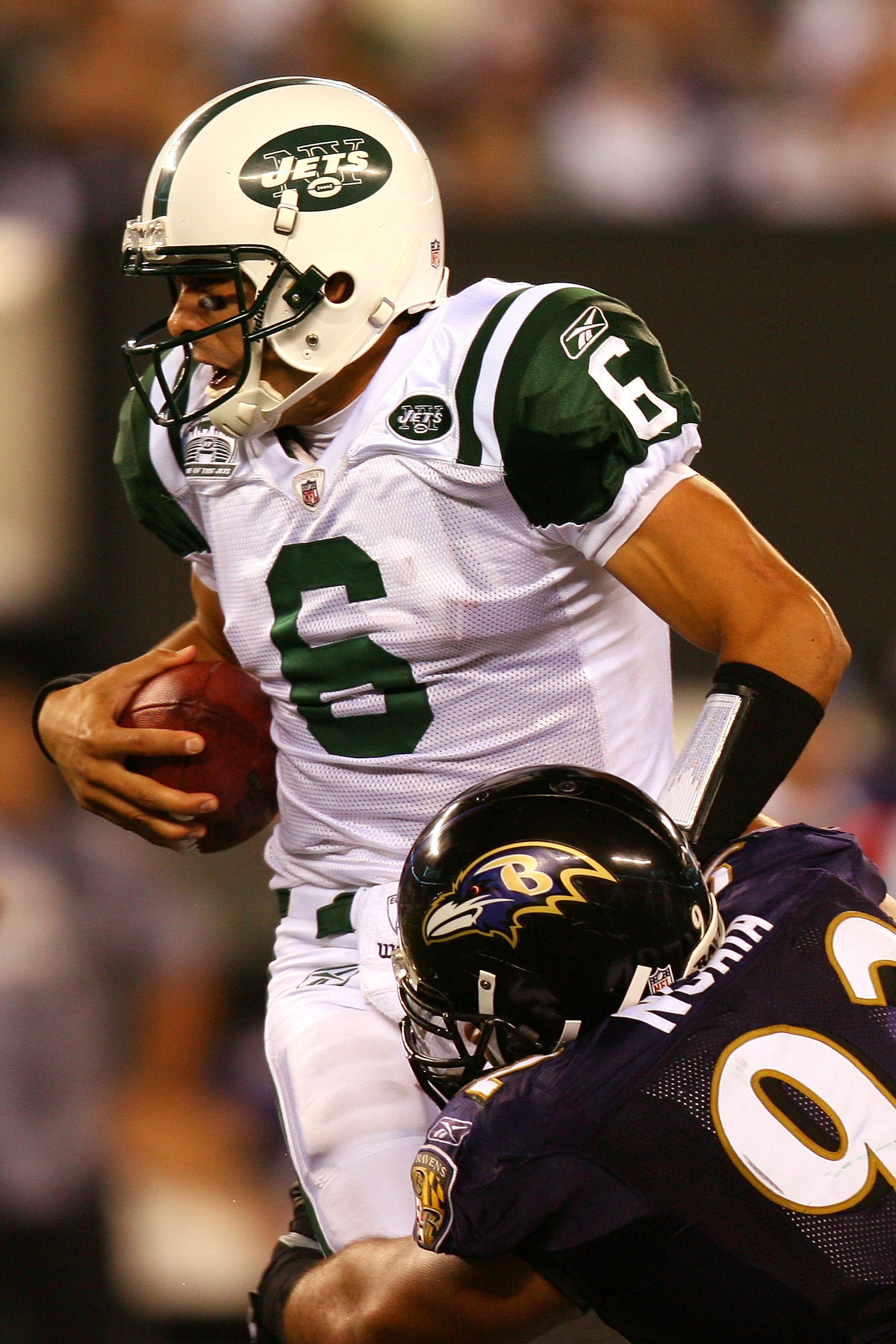 EAST RUTHERFORD, NJ - SEPTEMBER 13:  Mark Sanchez #6 of the New York Jets gets sacked by Haloti Ngata #92 of the Baltimore Ravens during their home opener at the New Meadowlands Stadium on September 13, 2010 in East Rutherford, New Jersey.  (Photo by Andr