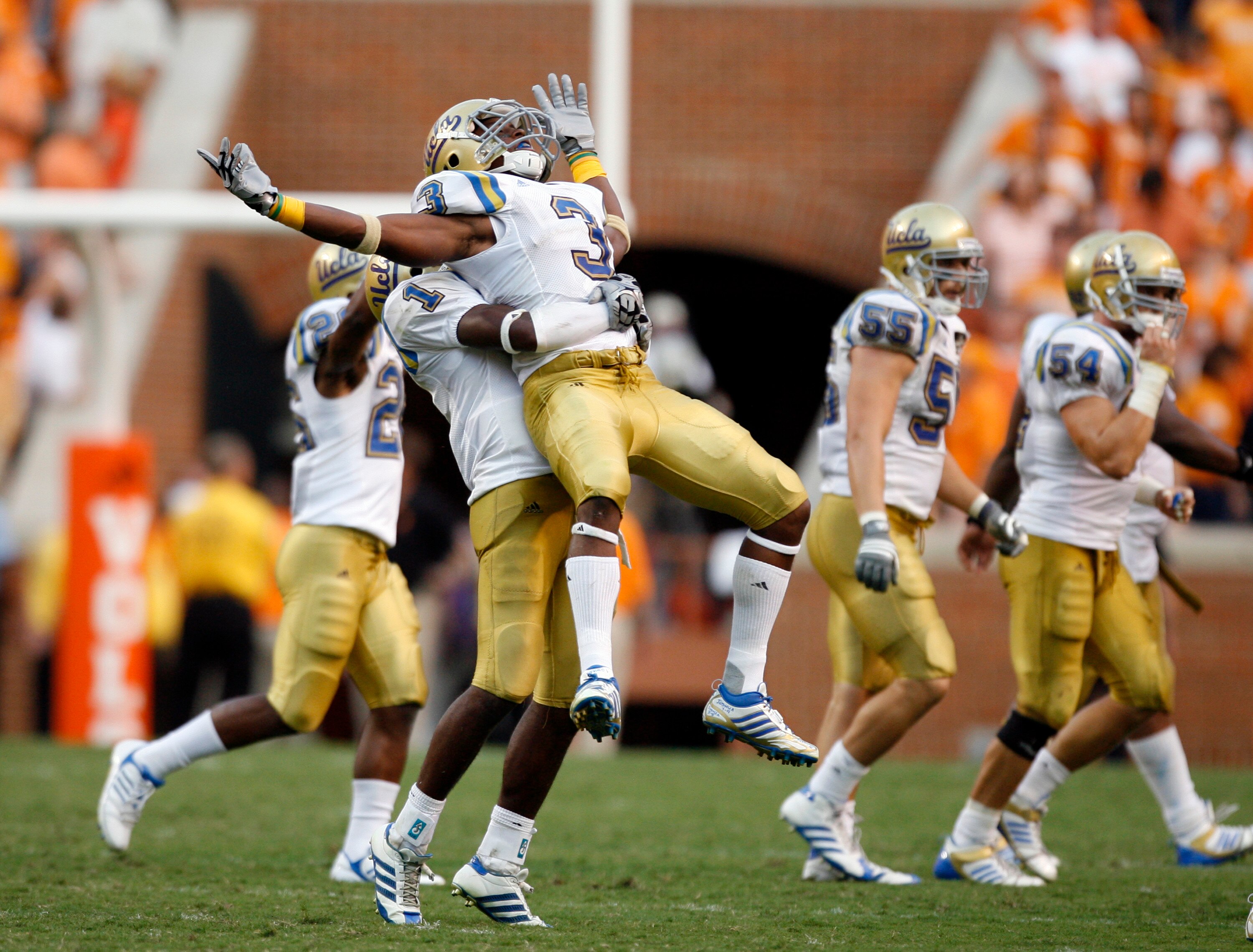 KNOXVILLE, TN - SEPTEMBER 12: Rahim Moore #3 and Alterraun Verner #1 of the UCLA Bruins celebrate at the end of the game against the Tennessee Volunteers on September 12, 2009 at Neyland Stadium in Knoxville, Tennessee. The Bruins beat the Volunteers 19-1