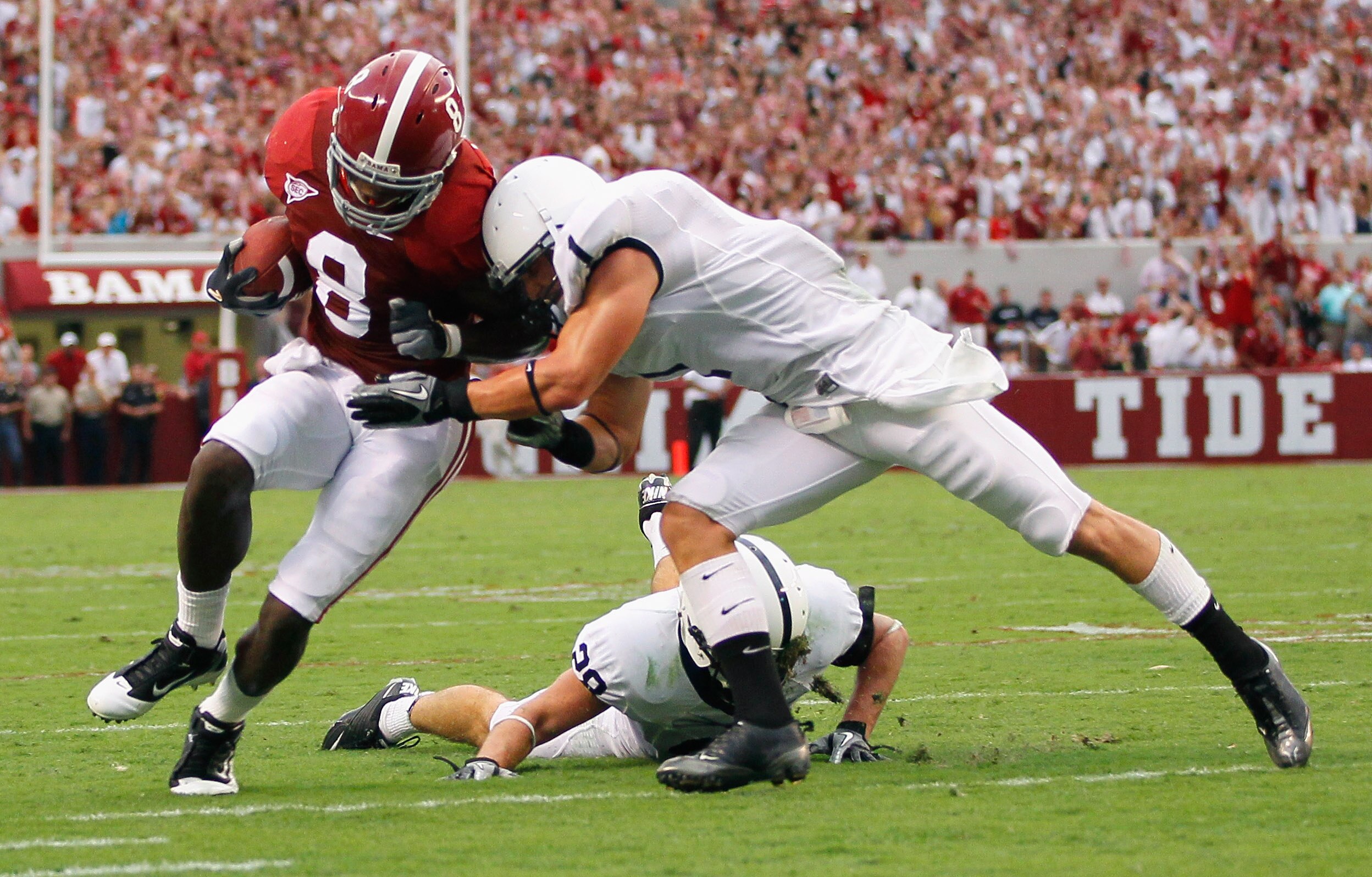 TUSCALOOSA, AL - SEPTEMBER 11:  Julio Jones #8 of the Alabama Crimson Tide is tackled by Nick Sukay #1 of the Penn State Nittany Lions at Bryant-Denny Stadium on September 11, 2010 in Tuscaloosa, Alabama.  (Photo by Kevin C. Cox/Getty Images)