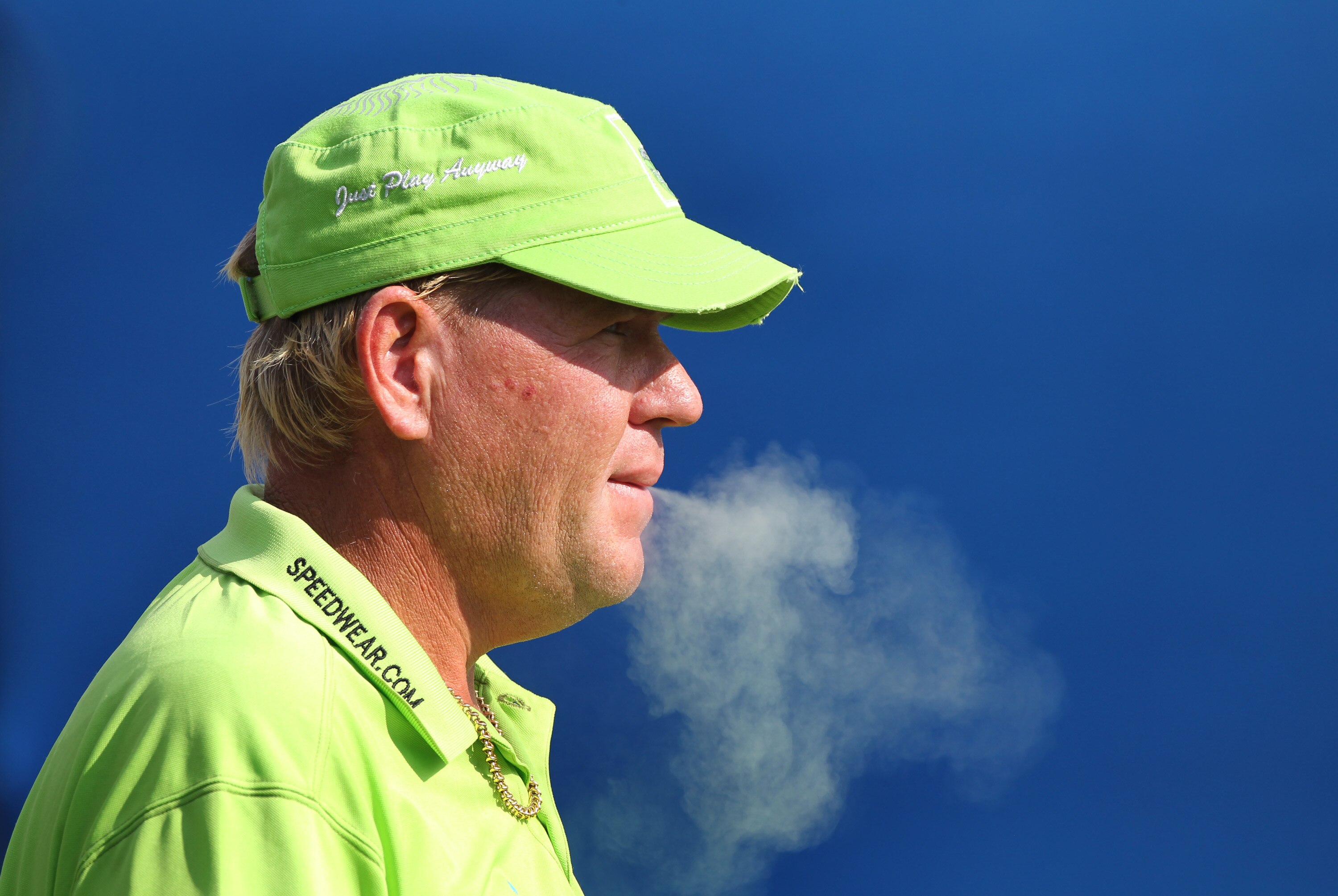 GREENSBORO, NC - AUGUST 20: John Daly has a smoke on the 10th tee during the second round of the Wyndham  Championship at Sedgefield Country Club on August 20, 2010 in Greensboro, North Carolina. (Photo by Hunter Martin/Getty Images)