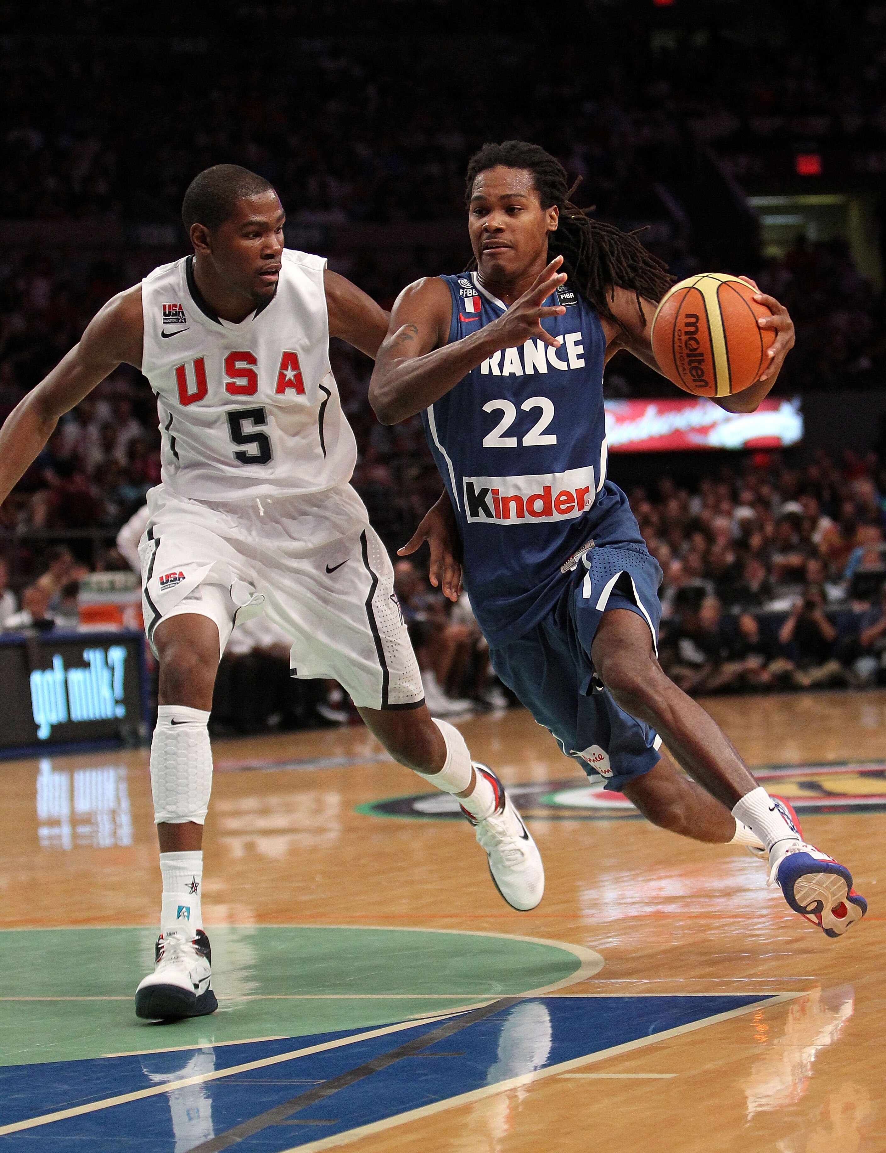 NEW YORK - AUGUST 15: Mickael Gelabale #22 of France drives to the basket past Kevin Durant #5 of the United States during their exhibition game as part of the World Basketball Festival at Madison Square Garden on August 15, 2010 in New York City.  (Photo