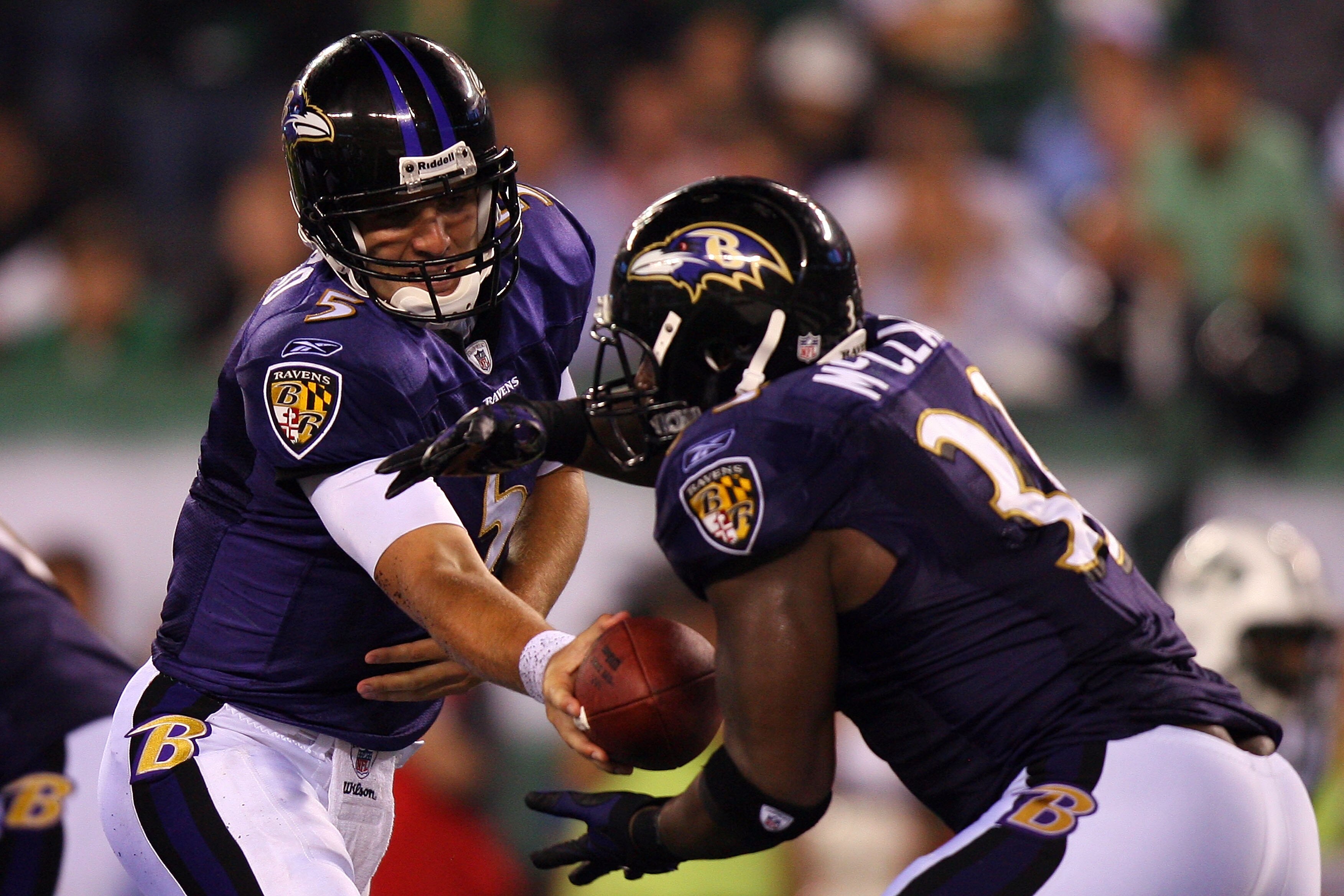 EAST RUTHERFORD, NJ - SEPTEMBER 13:  Joe Flacco #5  hands the ball to Willis McGahee #23 of the Baltimore Ravens against the New York Jets during their home opener at the New Meadowlands Stadium on September 13, 2010 in East Rutherford, New Jersey.  (Phot