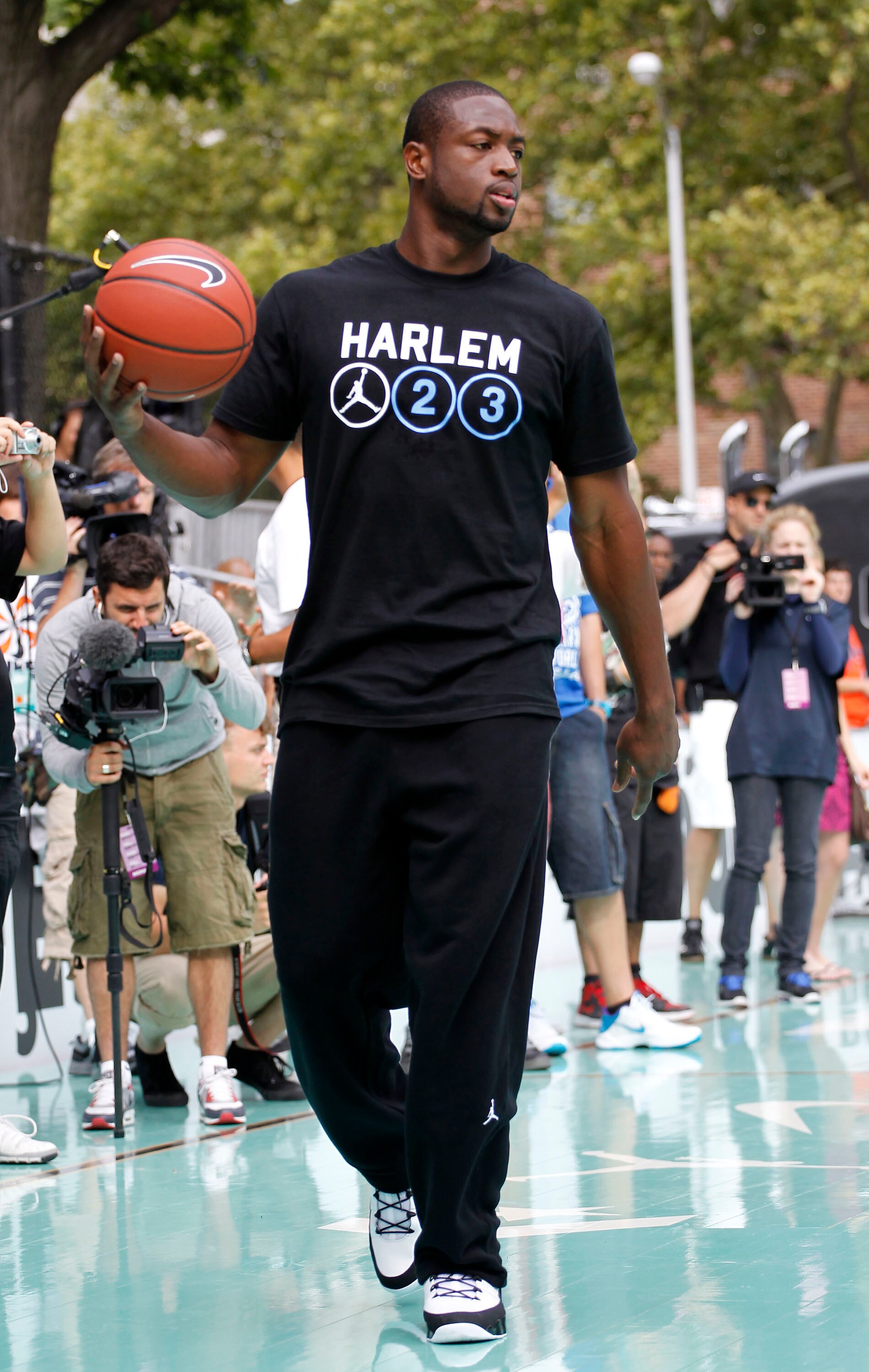 NEW YORK CITY, NY - AUGUST 13:  Dwyane Wade of USAB practices with young athletes during the World Basketball Festival at Rucker Park on August 13, 2010 in New York City.  (Photo by Chris Trotman/Getty Images for Nike)