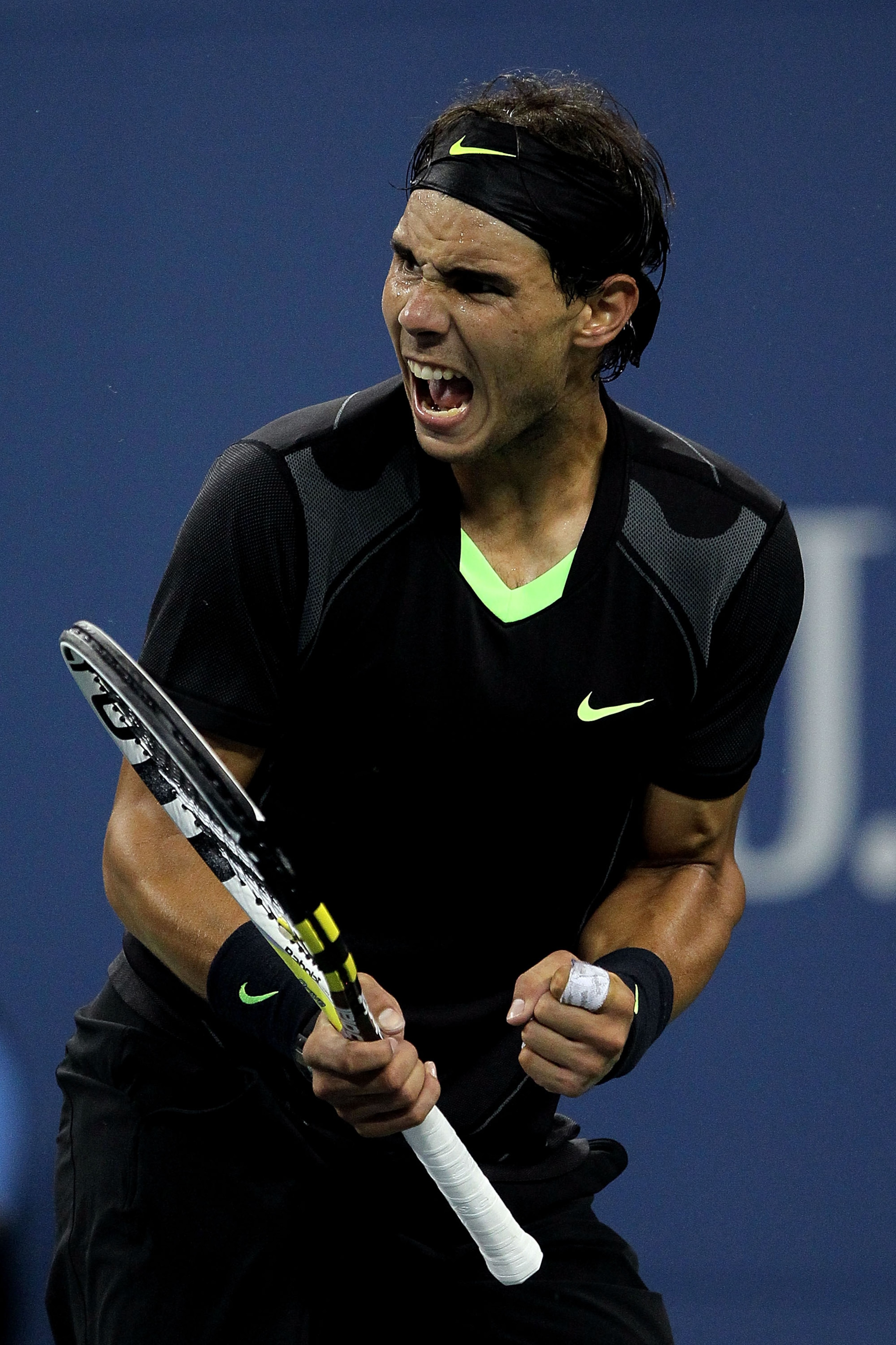 NEW YORK - SEPTEMBER 13: Rafael Nadal of Spain reacts while playing against Novak Djokovic of Serbia during his men's singles final match on day fifteen of the 2010 U.S. Open at the USTA Billie Jean King National Tennis Center on September 13, 2010 in th NEW YORK - SEPTEMBER 13: Rafael Nadal of Spain reacts while playing against Novak Djokovic of Serbia during his men's singles final match on day fifteen of the 2010 U.S. Open at the USTA Billie Jean King National Tennis Center on September 13, 2010 in th