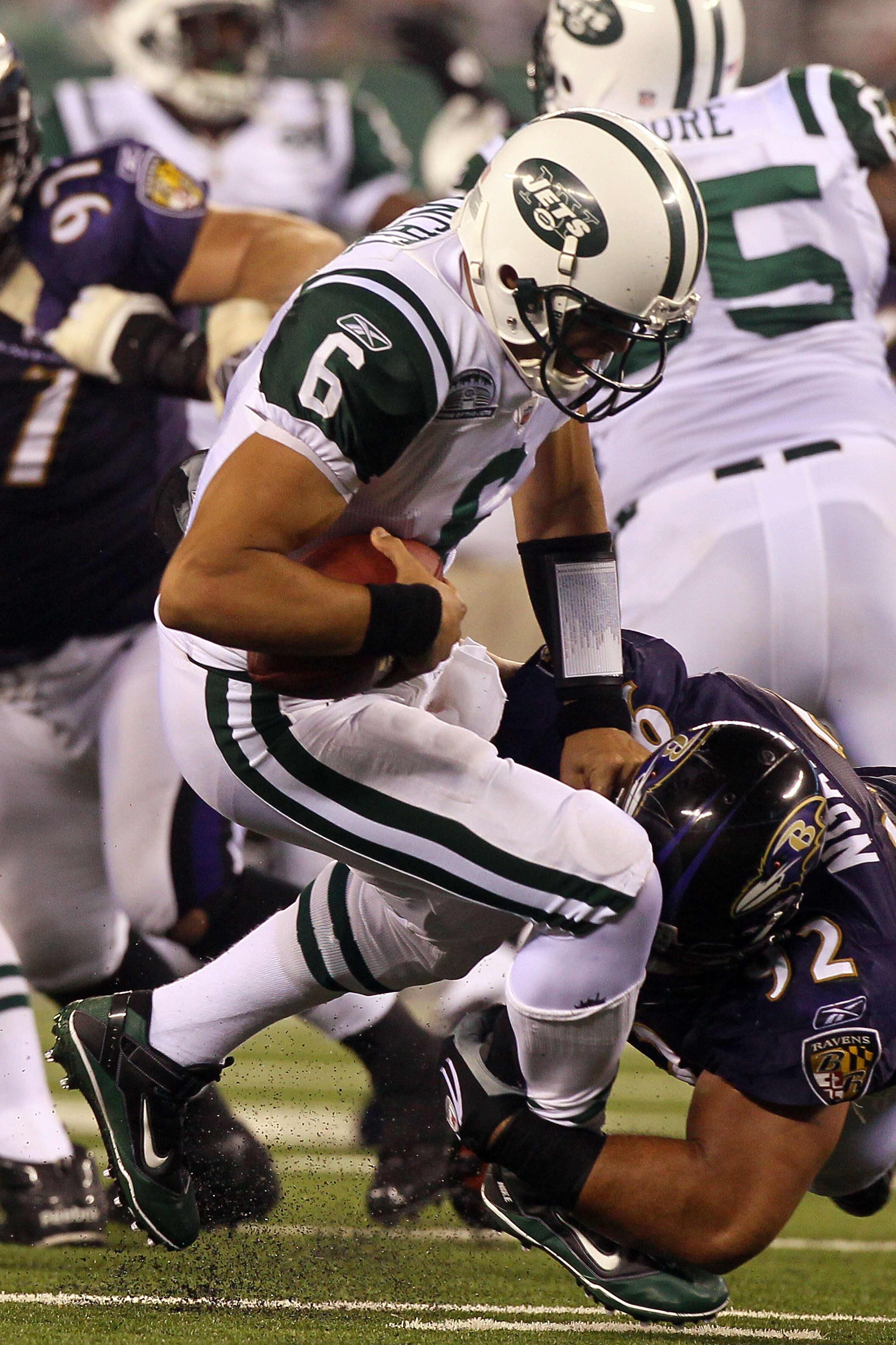 EAST RUTHERFORD, NJ - SEPTEMBER 13:  Mark Sanchez #6 of the New York Jets gets sacked by Haloti Ngata #92 of the Baltimore Ravens during their home opener at the New Meadowlands Stadium on September 13, 2010 in East Rutherford, New Jersey.  (Photo by Jim 