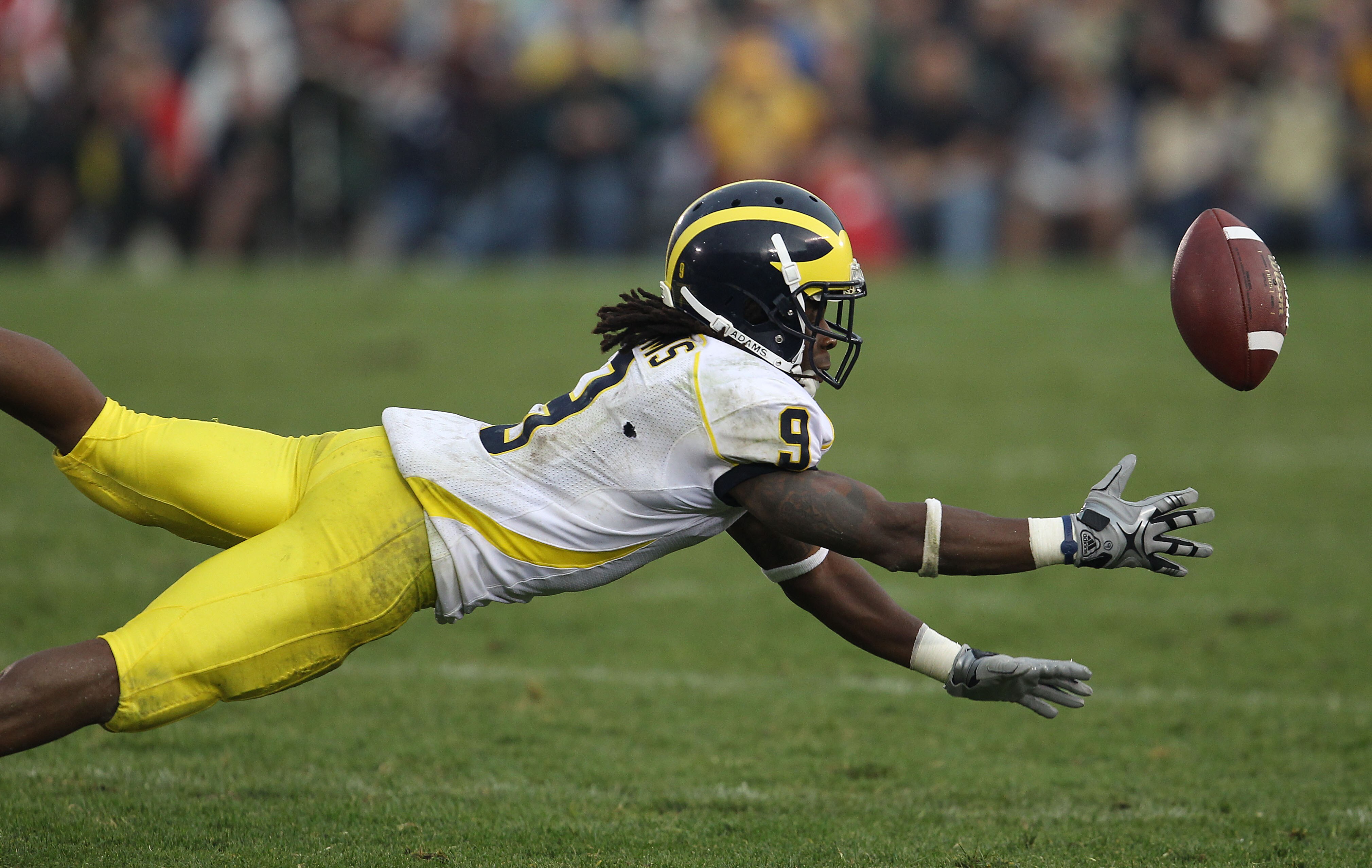 SOUTH BEND, IN - SEPTEMBER 11: Martavious Odoms #9 of the Michigan Wolverines misses a catch against the Notre Dame Fighting Irish at Notre Dame Stadium on September 11, 2010 in South Bend, Indiana. Michigan defeated Notre Dame 28-24. (Photo by Jonathan D