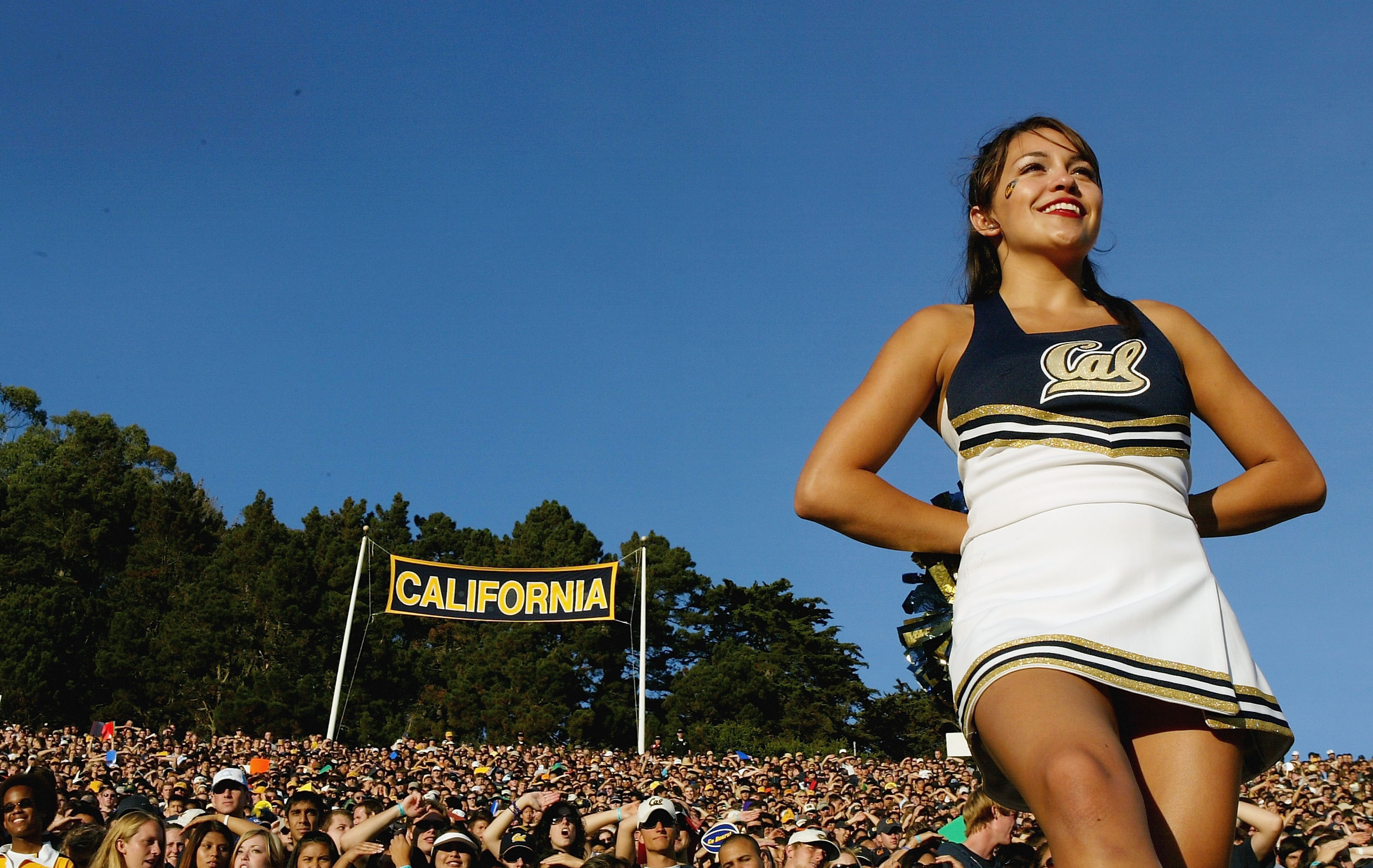 BERKELEY, CA - OCTOBER 01:  A cheerleader watches the game between the California Golden Bears and the Arizona Wildcats on October 1, 2005 at Memorial Stadium in Berkeley, California.  (Photo by Jonathan Ferrey/Getty Images)