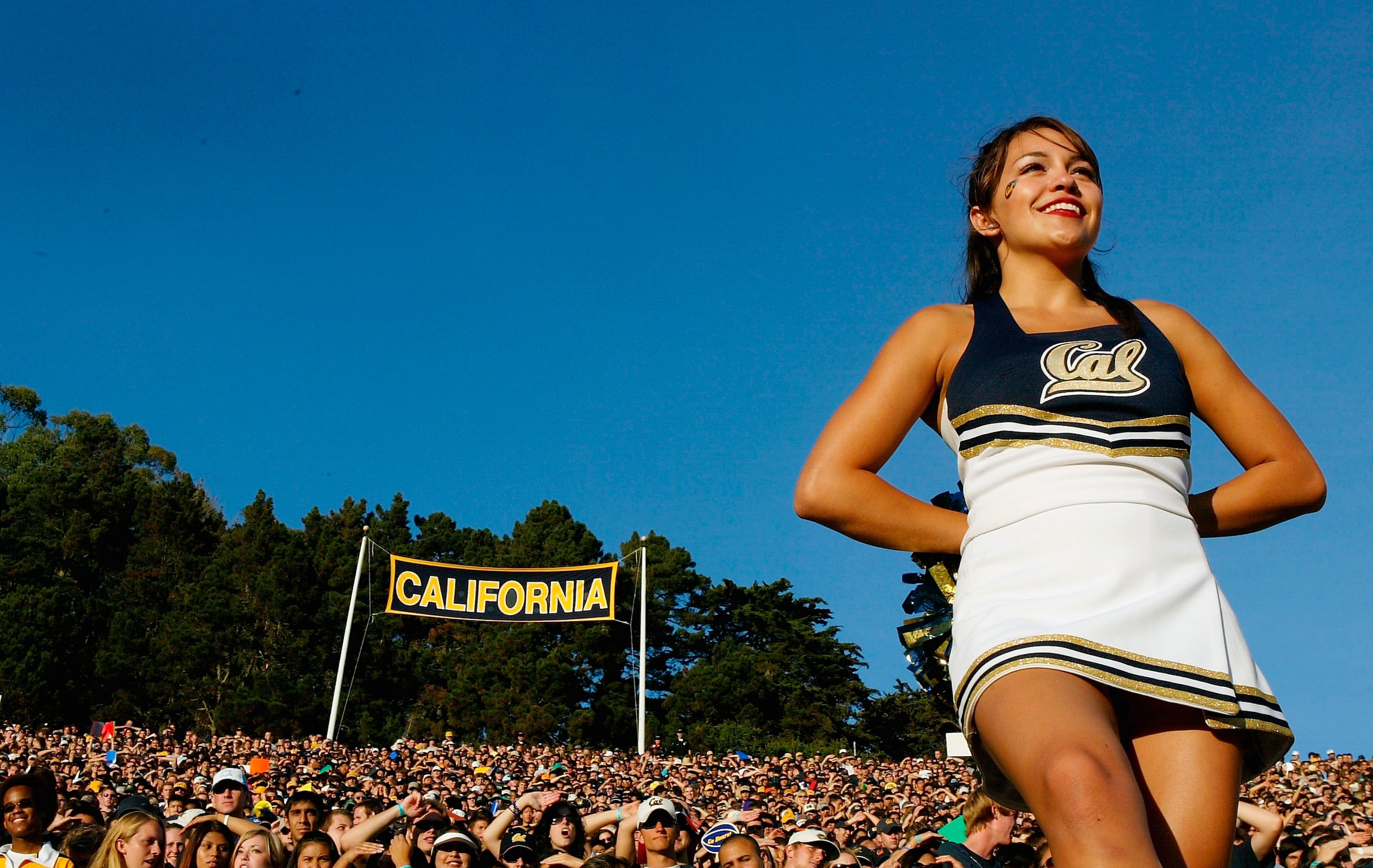 BERKELEY, CA - OCTOBER 01:  A cheerleader watches the game between the California Golden Bears and the Arizona Wildcats on October 1, 2005 at Memorial Stadium in Berkeley, California.  (Photo by Jonathan Ferrey/Getty Images)