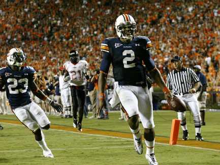 Cam Newton scores a touchdown against Arkansas State