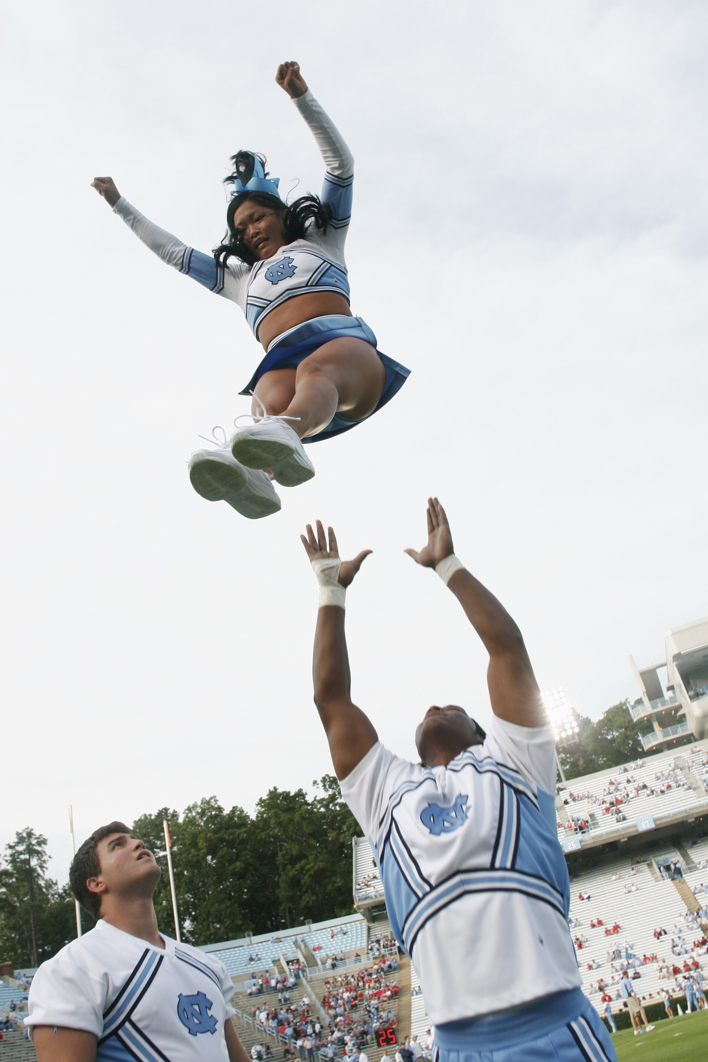 CHAPEL HILL, NC - OCTOBER 9:  A North Carolina Tar Heels cheerleaders perform during the game against the North Carolina State Wolfpack on October 9, 2004 at Kenan Stadium Stadium in Chapel Hill, North Carolina. North Carolina defeated North Carolina Stat