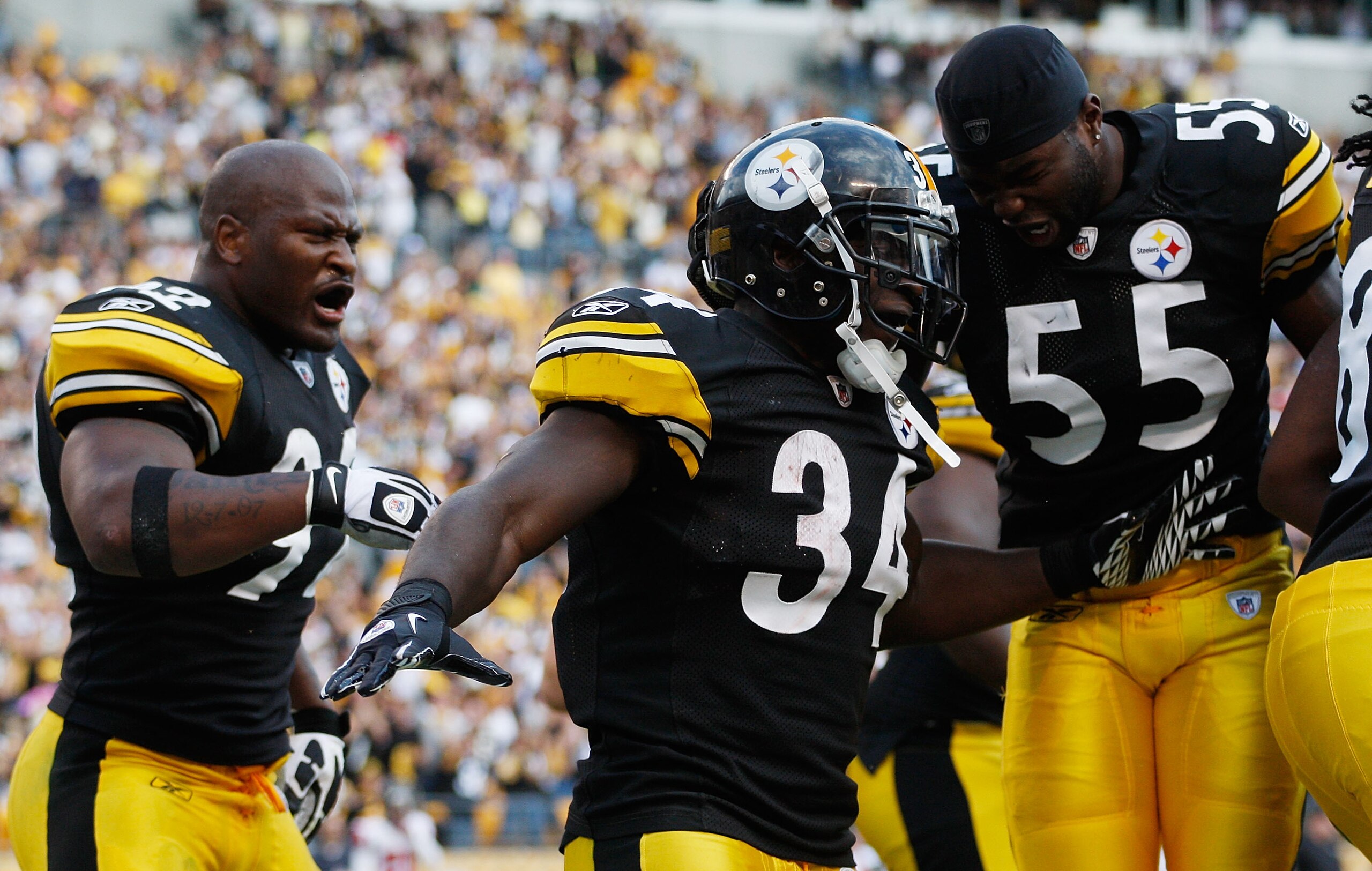 PITTSBURGH - SEPTEMBER 12:  Rashard Mendenhall #34 of the Pittsburgh Steelers celebrates with teammates Stevenson Sylvester #55 and James Harrison #92 after scoring the game winning touchdown on a 50-yard run against the Atlanta Falcons during the NFL sea