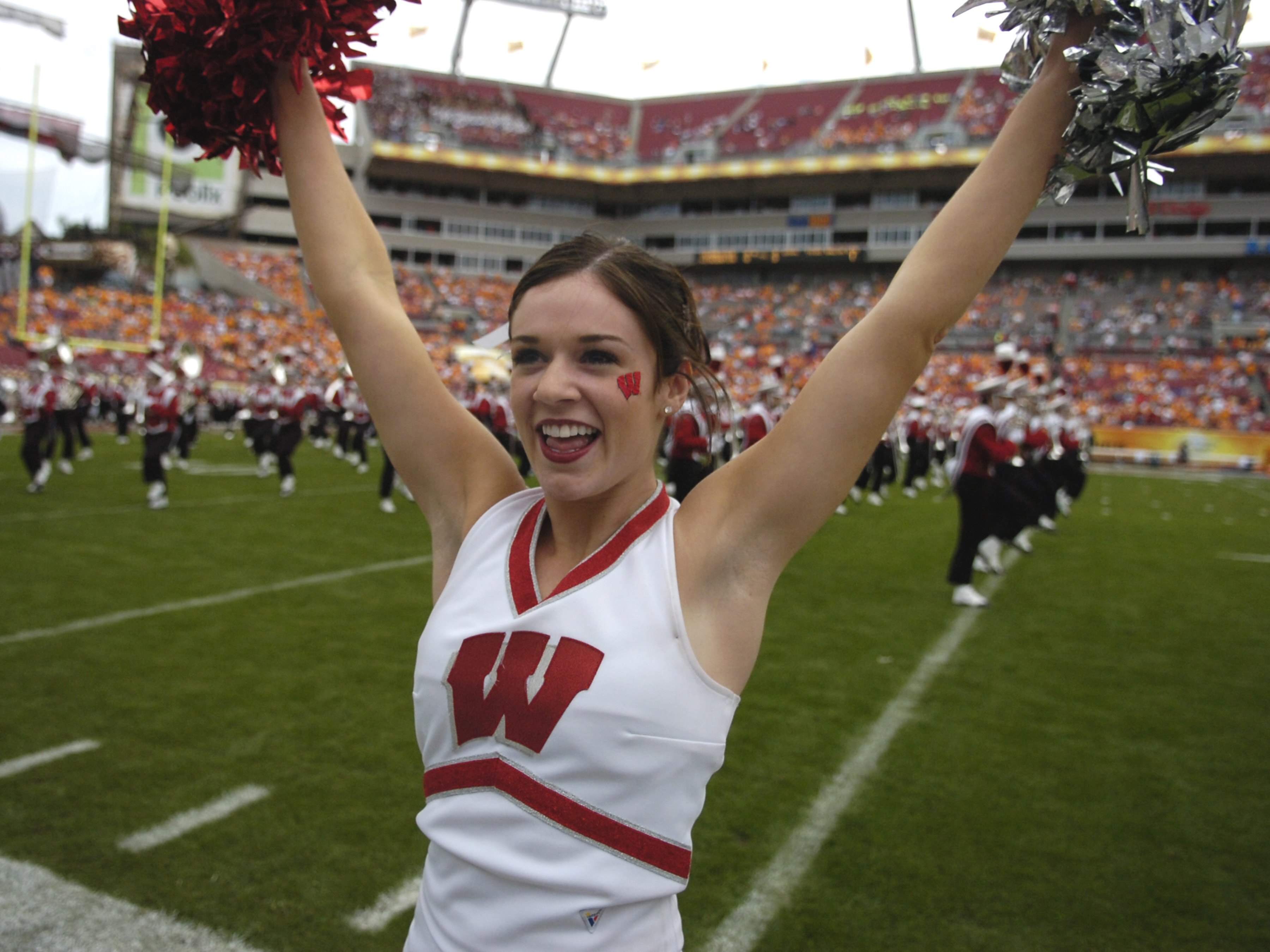 TAMPA, FL -  JANUARY 1: A cheerleader for the Wisconsin Badgers entertains fans during play against the Tennessee Volunteers in the 2008 Outback Bowl at Raymond James Stadium on January 1, 2008 in Tampa, Florida.  The Volunteers won 21 - 17. (Photo by Al