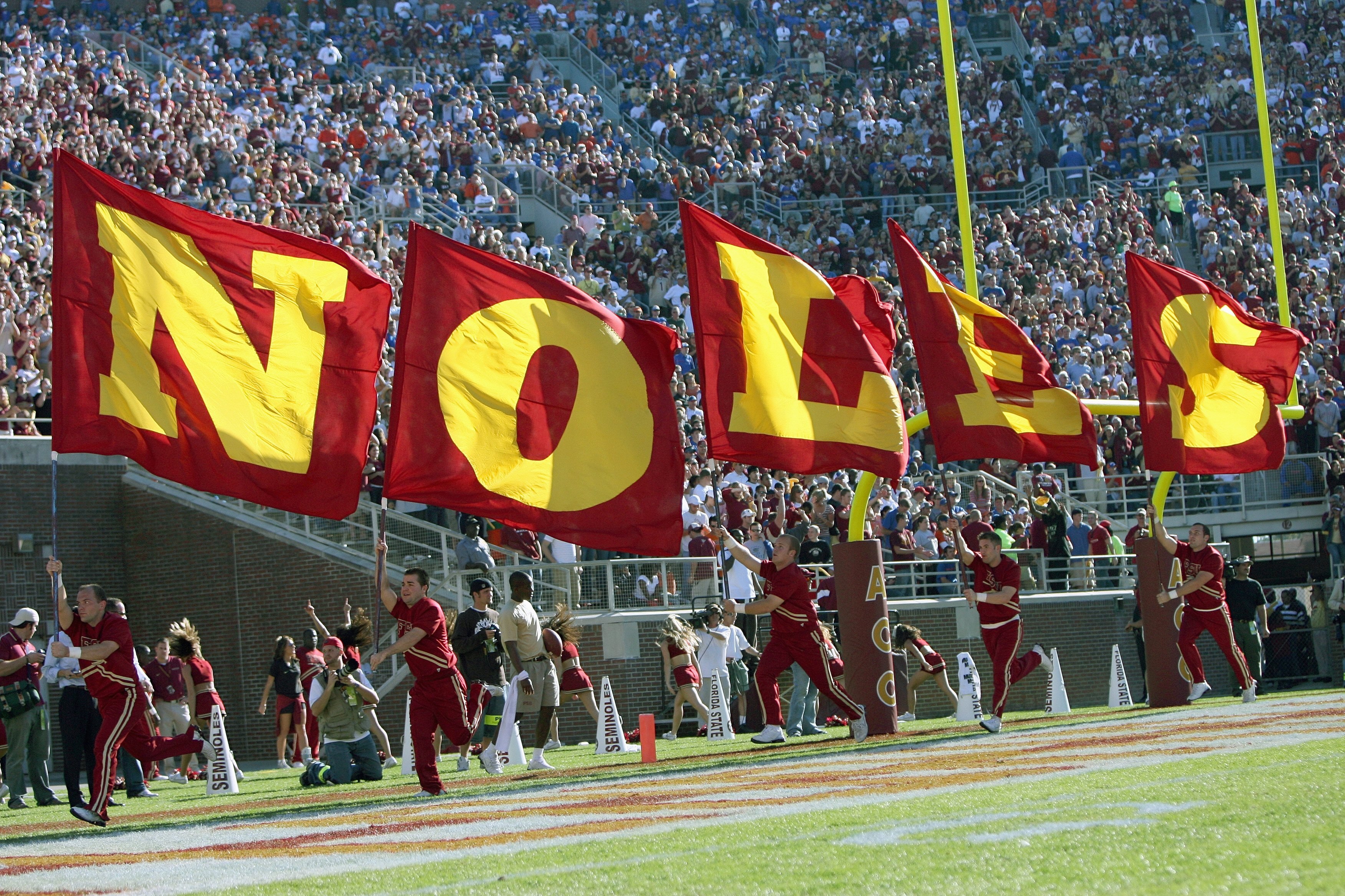 TALLAHASSEE, FL - NOVEMBER 25:  The cheer squad of the Florida State Seminoles carry banners before the game against the Florida Gators at Doak Campbell Stadium November 25, 2006 in Tallahassee, Florida. (Photo by Doug Benc/Getty Images)