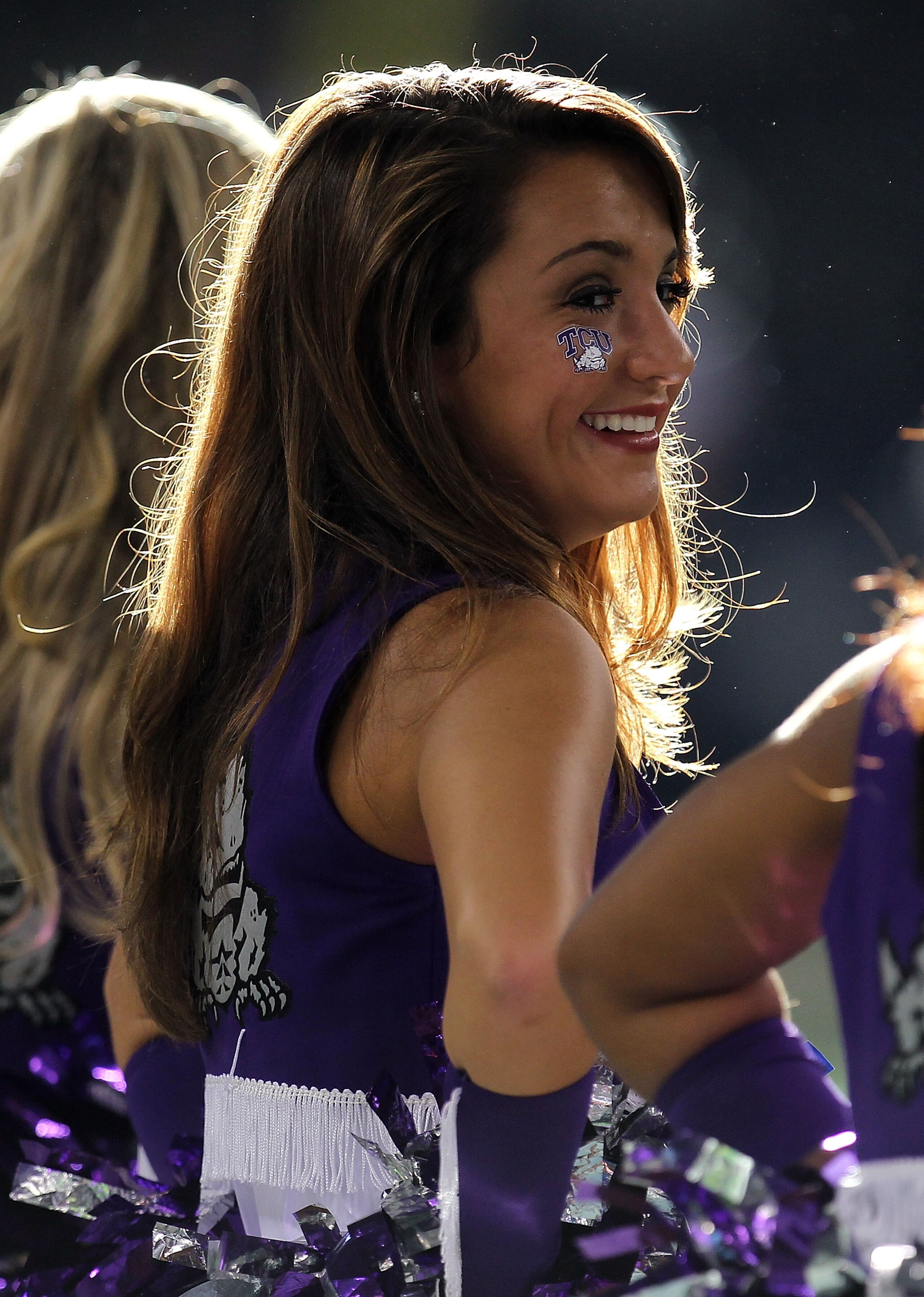 ARLINGTON, TX - SEPTEMBER 04:  A TCU Horned Frogs cheerleader smiles during a game against the Oregon State Beavers at Cowboys Stadium on September 4, 2010 in Arlington, Texas.  (Photo by Ronald Martinez/Getty Images)