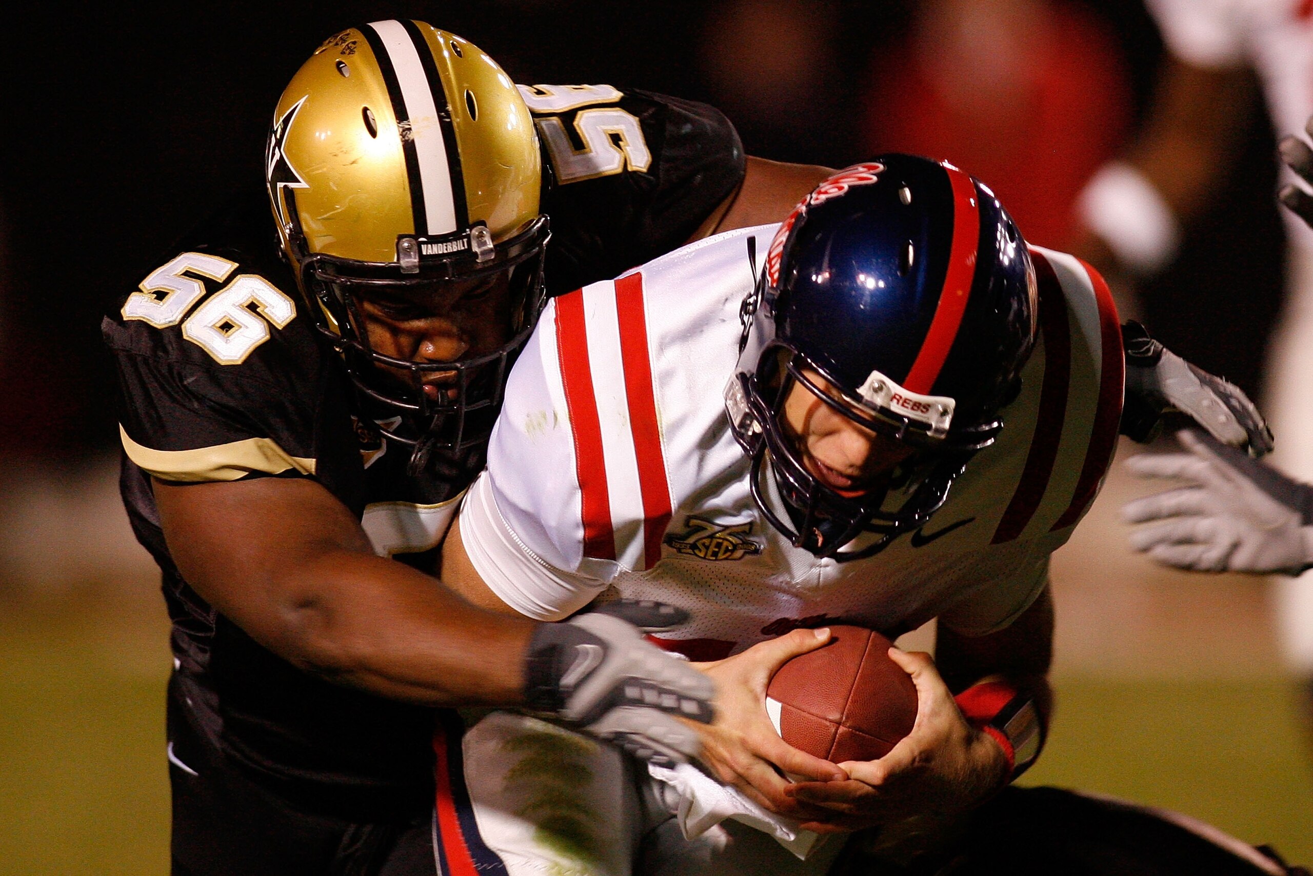 NASHVILLE, TN - SEPTEMBER 15:  Quarterback Seth Adams #19 of the Ole Miss Rebels is sacked by Gabe Hall #56 of the Vanderbilt Commodores on September 15, 2007 at Vanderbilt Stadium in Nashville, Tennessee.  The Commodores defeated the Rebels 31-17.  (Phot