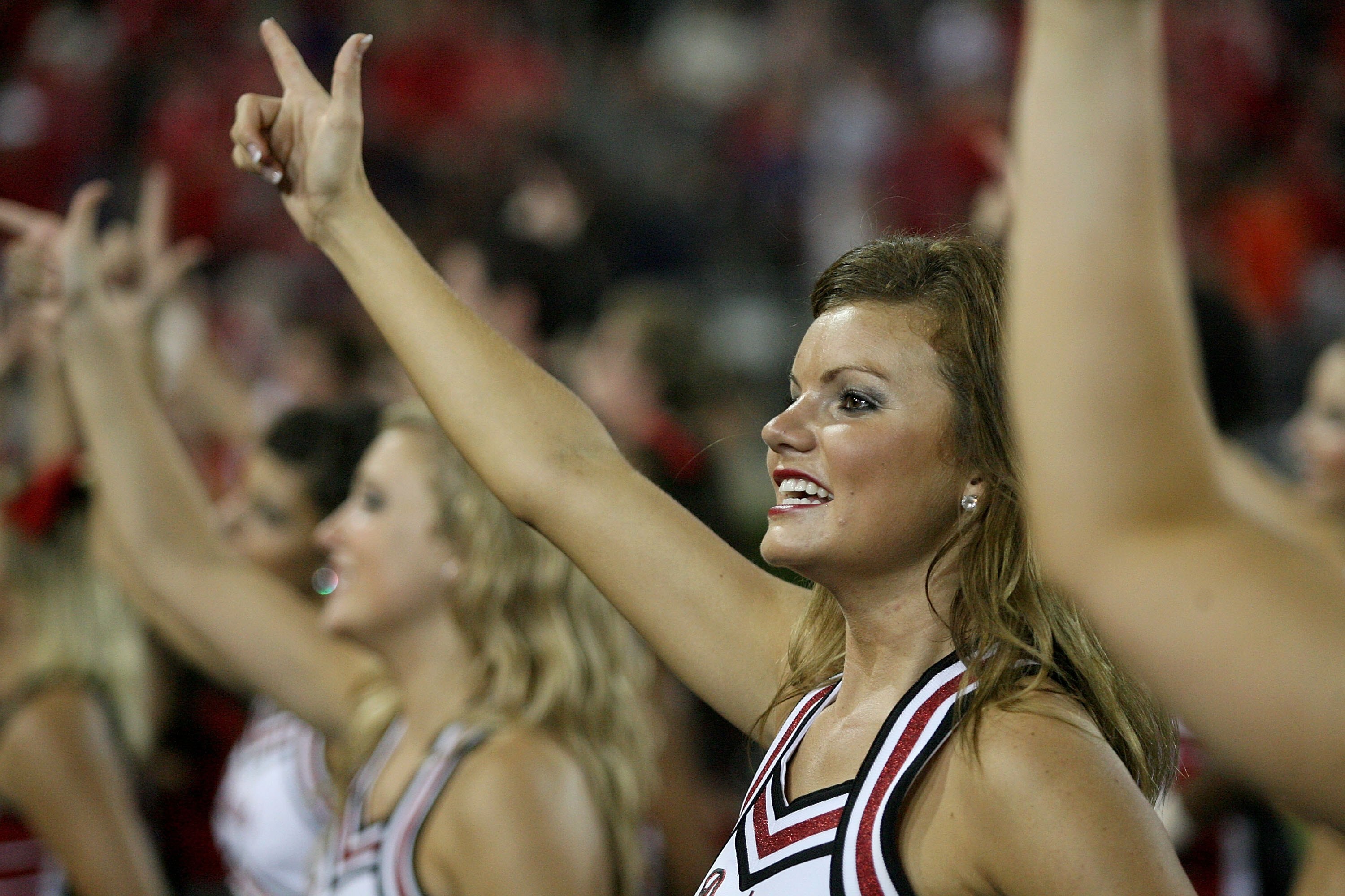 HOUSTON - SEPTEMBER 26:  Red Raider cheerleaders cheer during the Houston Cougars playing against the Texas Tech Red Raiders at Robertson Stadium on September 26, 2009 in Houston, Texas.  (Photo by Thomas B. Shea/Getty Images)