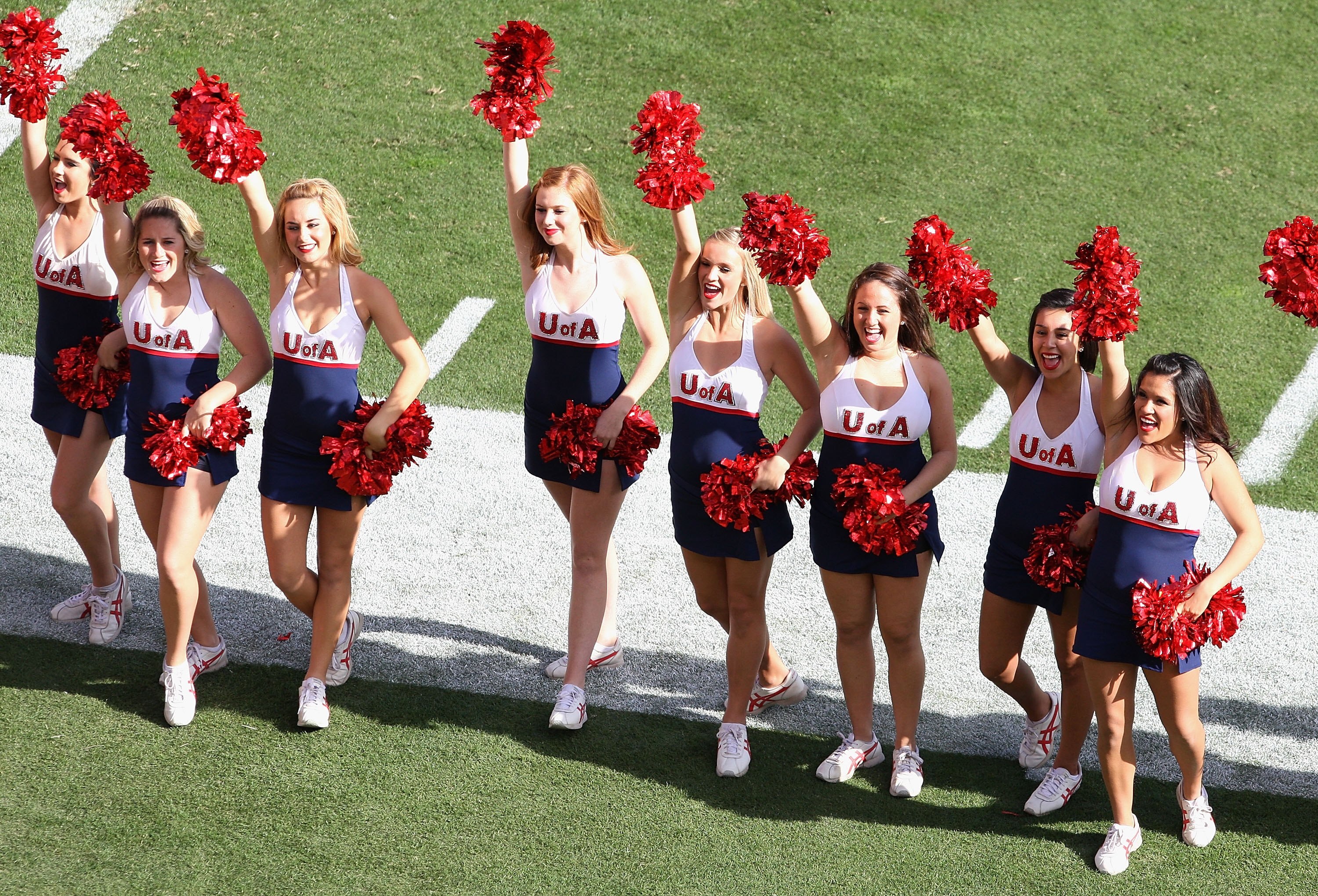 TEMPE, AZ - NOVEMBER 28:  The Arizona Wildcats cheerleaders perform before the college football game against the Arizona State Sun Devils at Sun Devil Stadium on November 28, 2009 in Tempe, Arizona. The Wildcats defeated the Sun Devils 20-17.  (Photo by C