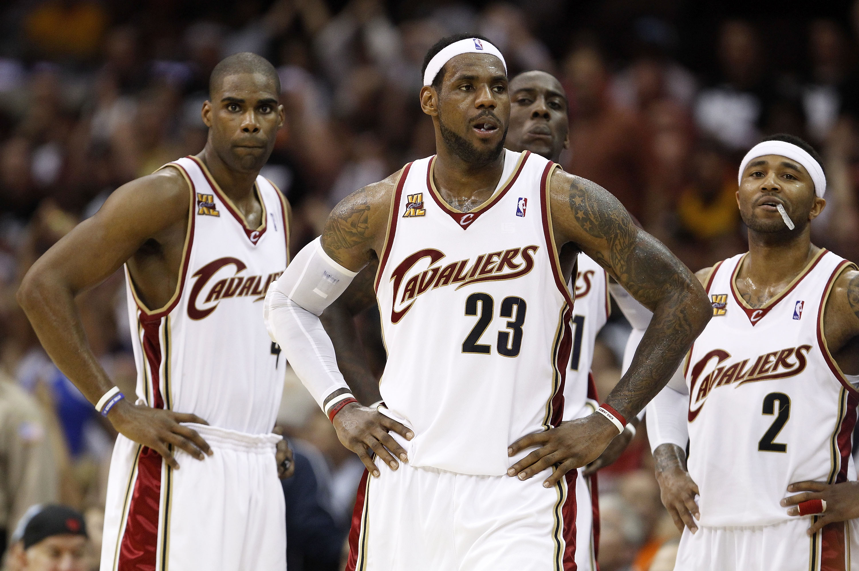 CLEVELAND - MAY 03:  LeBron James #23 of the Cleveland Cavaliers looks on with teammates Antawn Jamison #4 and Mo Williams #2 during a time while playing the Boston Celtics in Game Two of the Eastern Conference Semifinals during the 2010 NBA Playoffs at Q