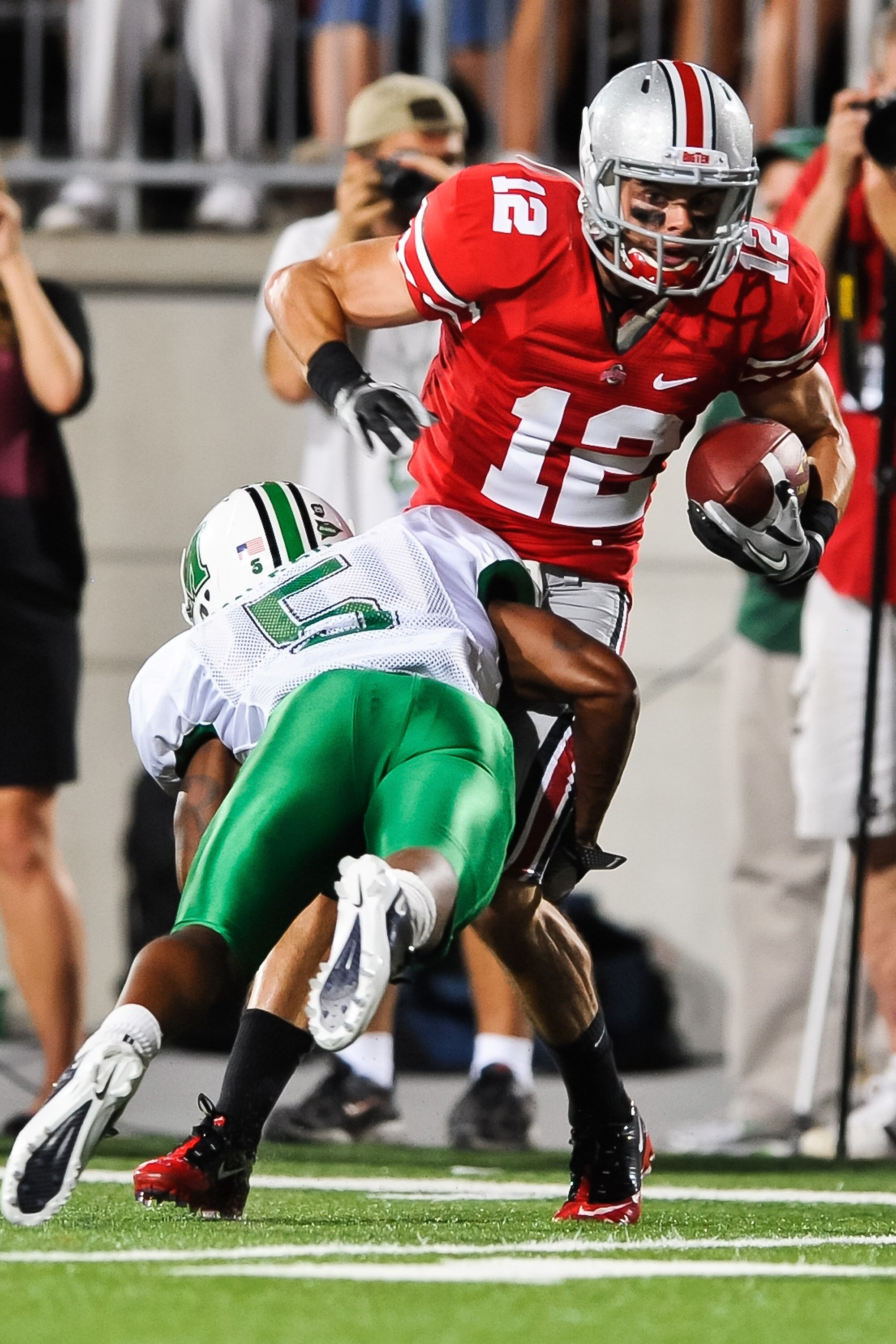 COLUMBUS, OH - SEPTEMBER 2: Dane Sanzenbacher #12 of the Ohio State Buckeyes runs with the ball against the Marshall Thundering Herd at Ohio Stadium on September 2, 2010 in Columbus, Ohio. (Photo by Jamie Sabau/Getty Images)