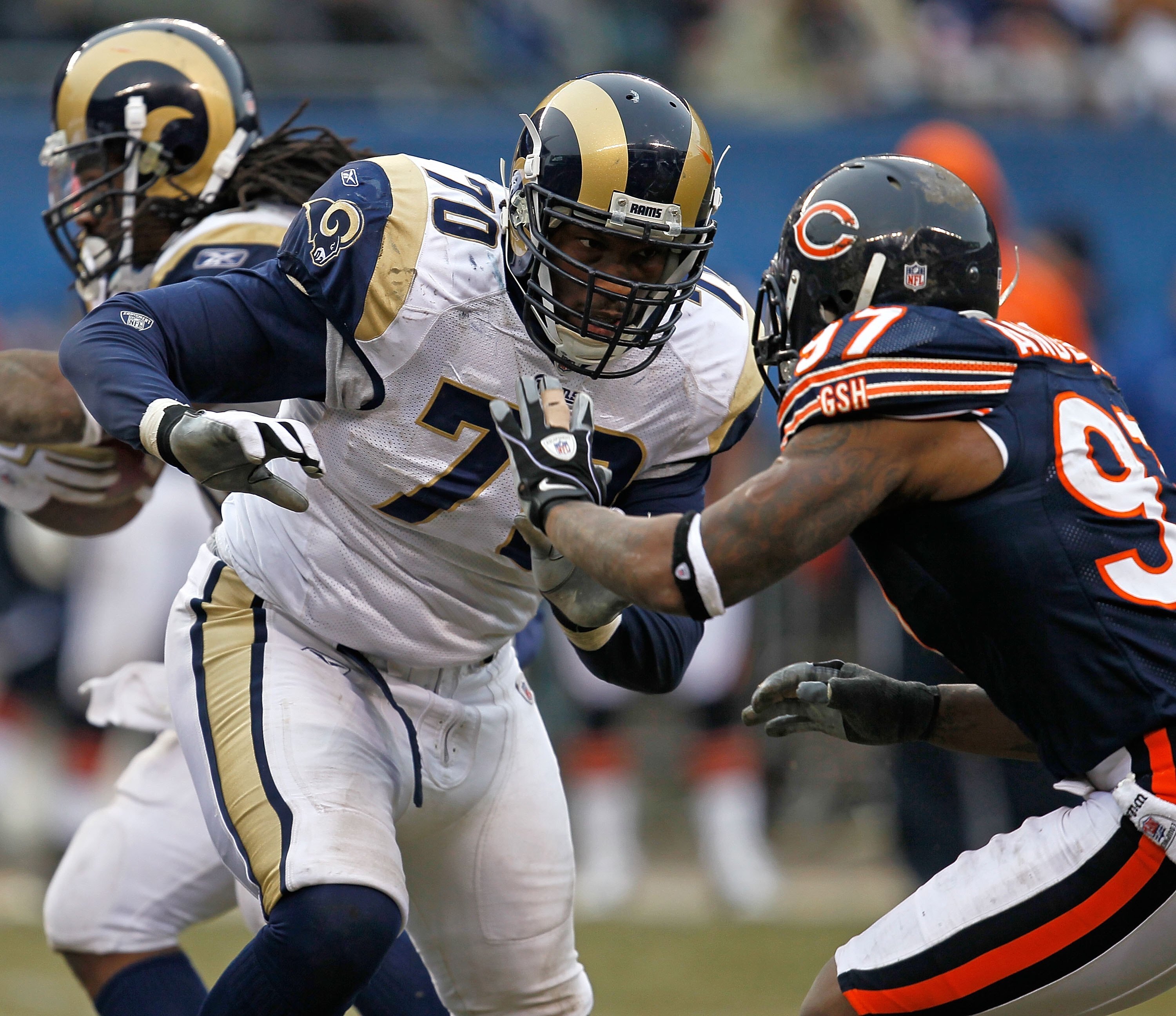 CHICAGO - DECEMBER 06: Alex Barron #70 of the St. Louis Rams movesto block Mark Anderson #97 of the Chicago Bears at Soldier Field on December 6, 2009 in Chicago, Illinois. The Bears defeated the Rams 17-9. (Photo by Jonathan Daniel/Getty Images)