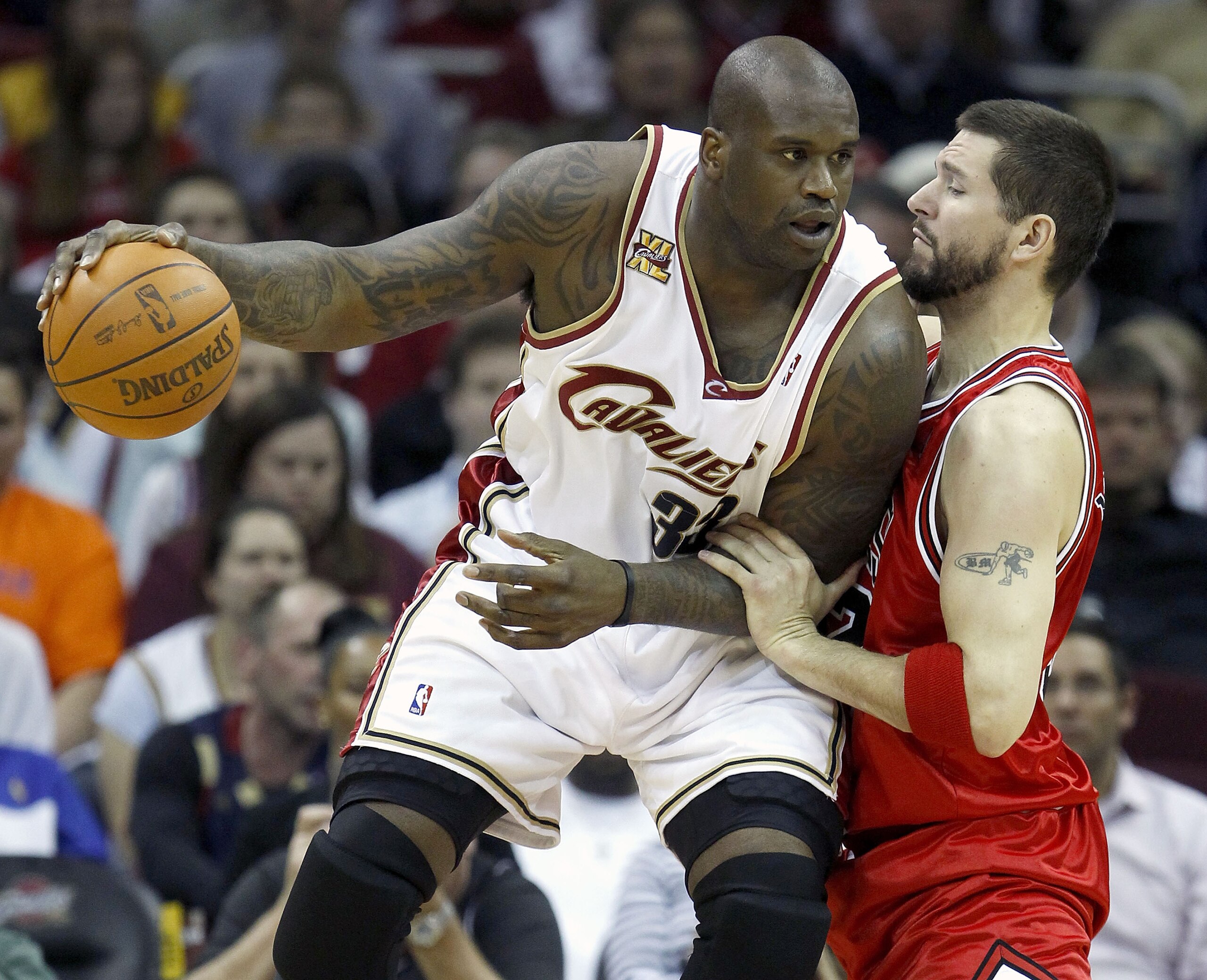 CLEVELAND - APRIL 27:  Shaquille O'Neal #33 of the Cleveland Cavaliers looks to get around Brad Miller #52 the Chicago Bulls in Game Five of the Eastern Conference Quarterfinals during the 2010 NBA Playoffs at Quicken Loans Arena on April 27, 2010 in Clev