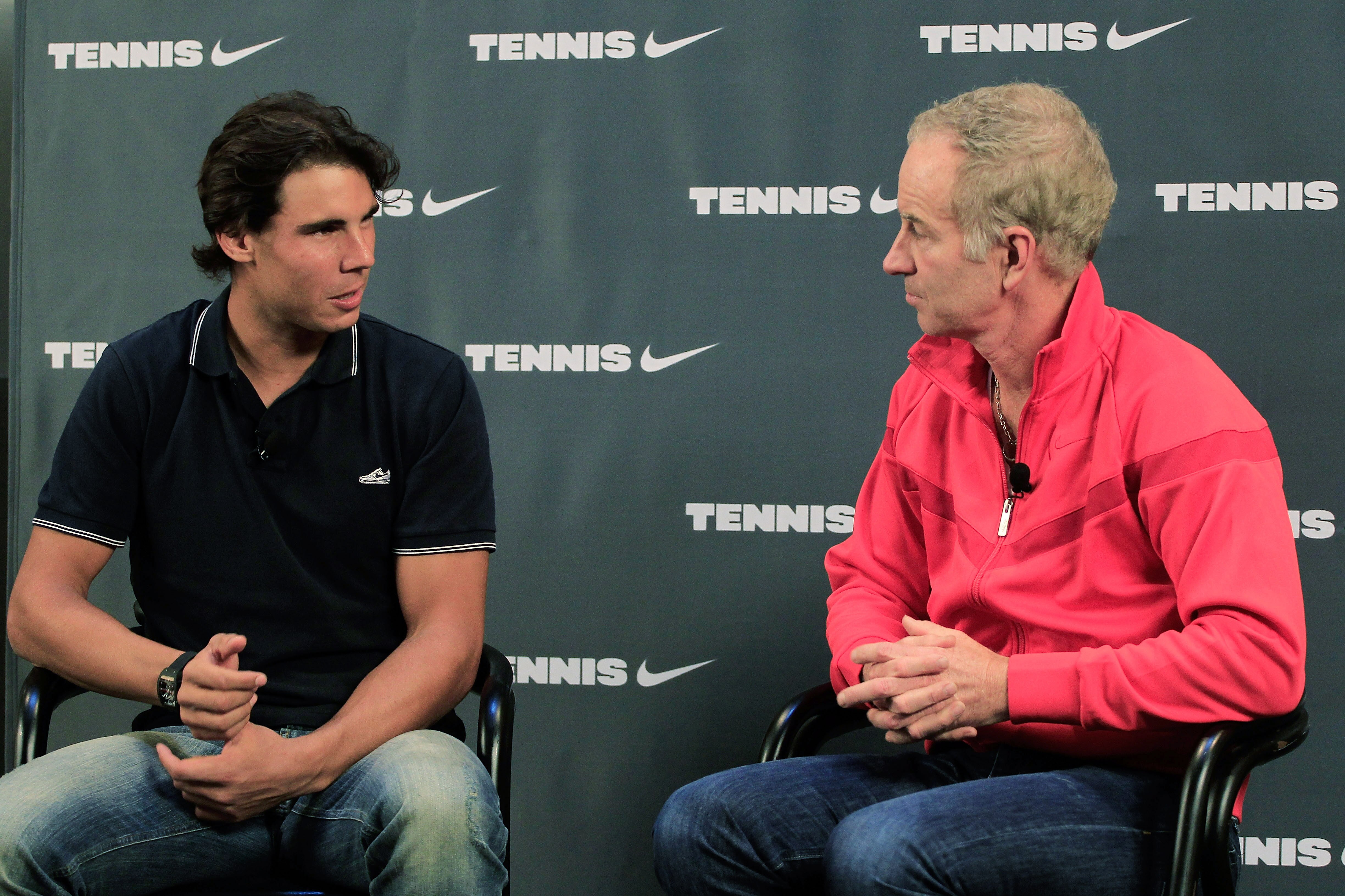 NEW YORK - SEPTEMBER 14:  Rafael Nadal (L) of Spain, the 2010 U.S. Open Champion is interviewed on stage by John McEnroe during an appearance at Niketown on September 14, 2010 in New York City.  (Photo by Chris Trotman/Getty Images for ATP)