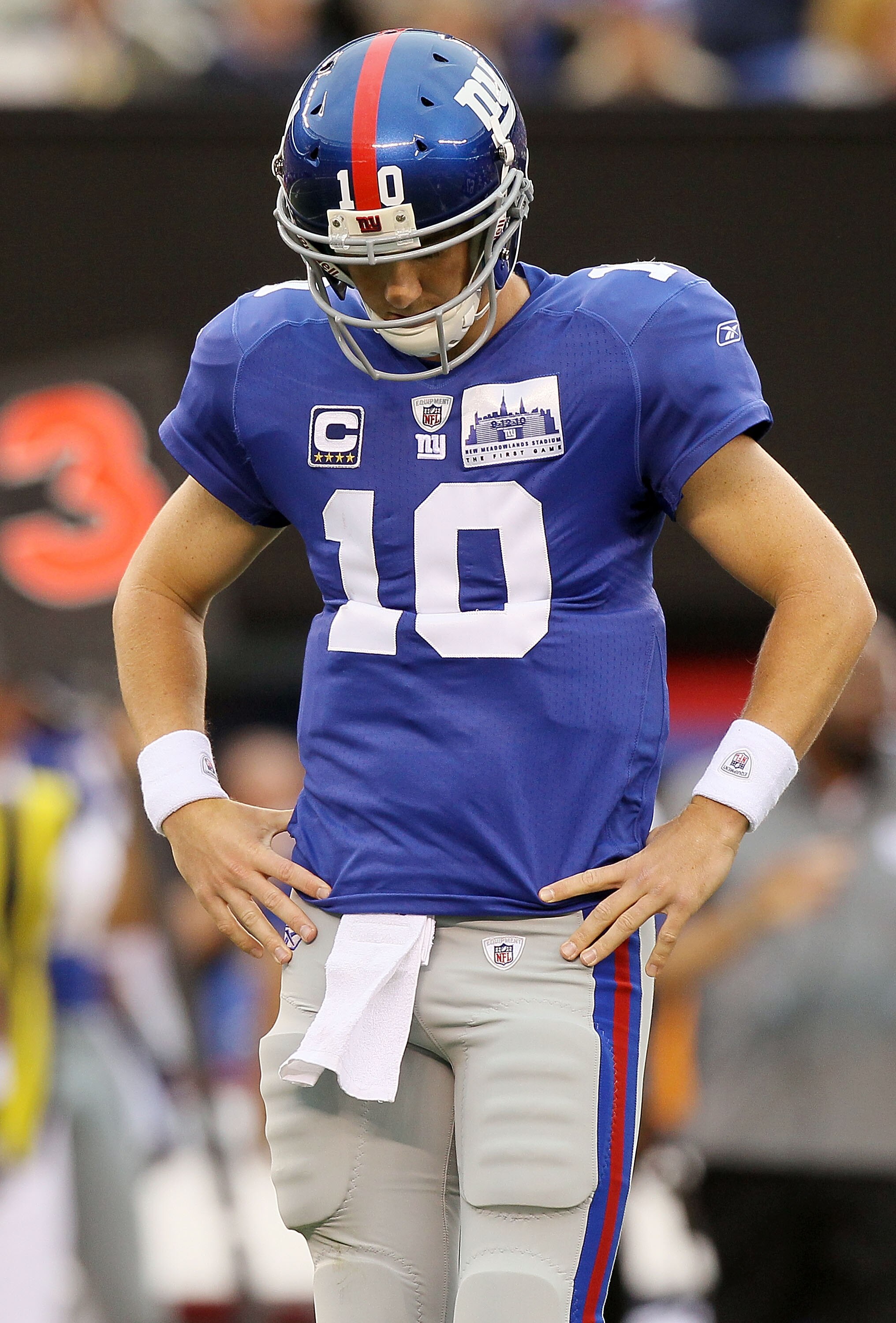 EAST RUTHERFORD, NJ - SEPTEMBER 12:  Eli Manning #10 of the New York Giants looks on against the Carolina Panthers on September 12, 2010 at the New Meadowlands Stadium in East Rutherford, New Jersey.  (Photo by Jim McIsaac/Getty Images)