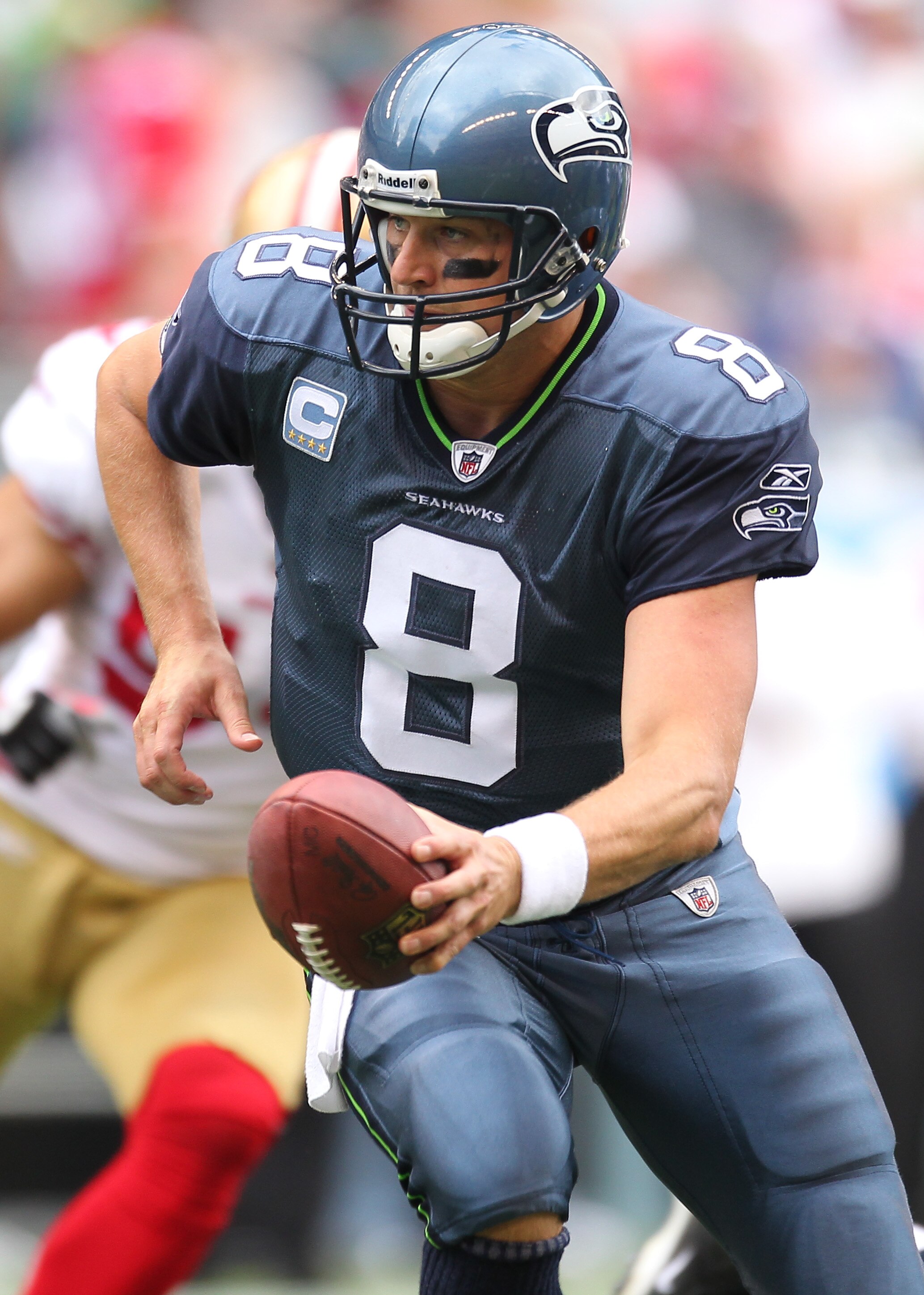 SEATTLE - SEPTEMBER 12:  Quarterback Matt Hasselbeck #8 of the Seattle Seahawks looks to hand off during the NFL season opener against the San Francisco 49ers at Qwest Field on September 12, 2010 in Seattle, Washington. (Photo by Otto Greule Jr/Getty Imag