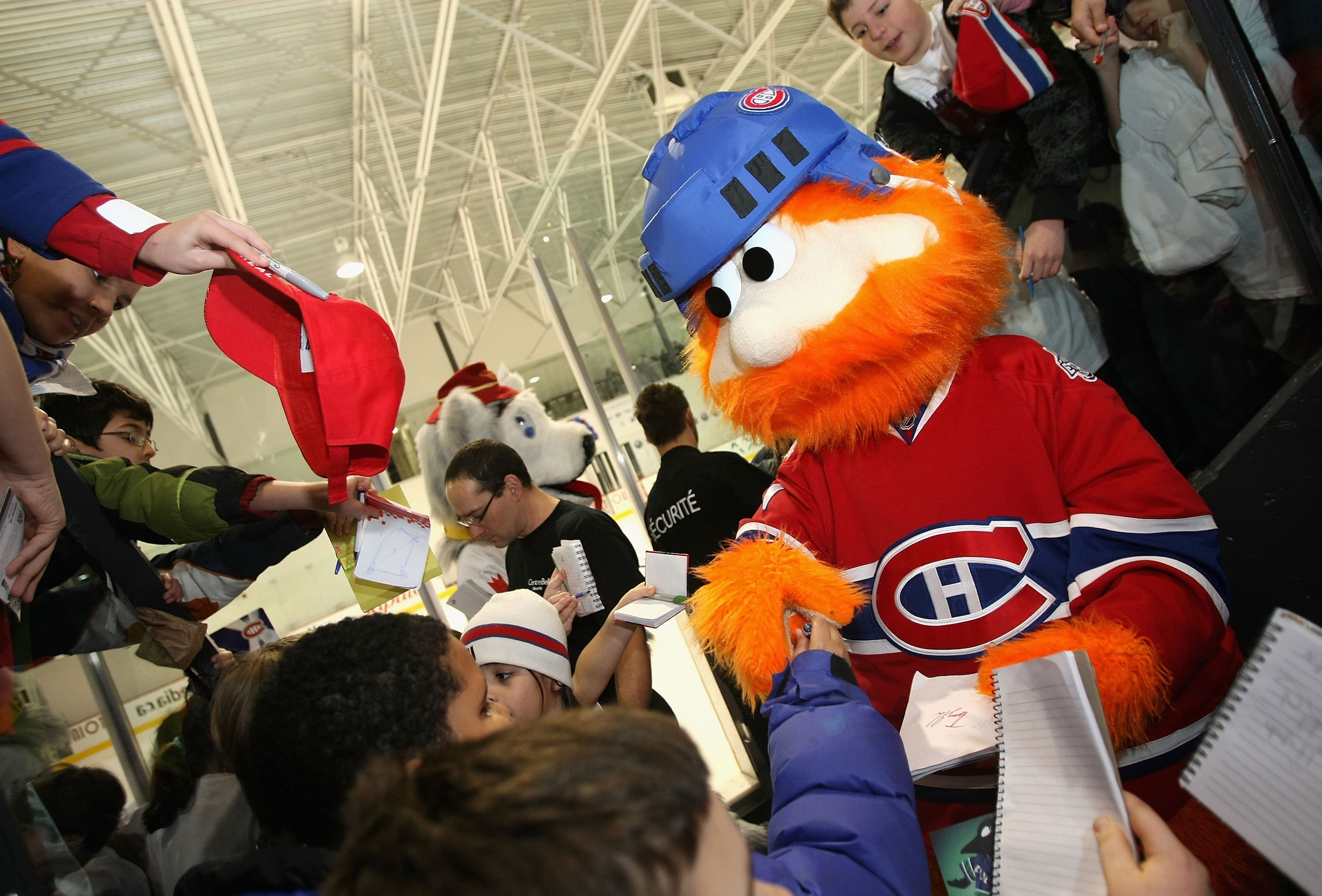 MONTREAL - JANUARY 25:  Montreal Canadiens mascot, Youppi signs autographs for fans during the NHL All Star Mascot Breakfast at the Bell Centre Sports Complex on January 25, 2009 in Montreal, Canada.  (Photo by Nick Laham/Getty Images)