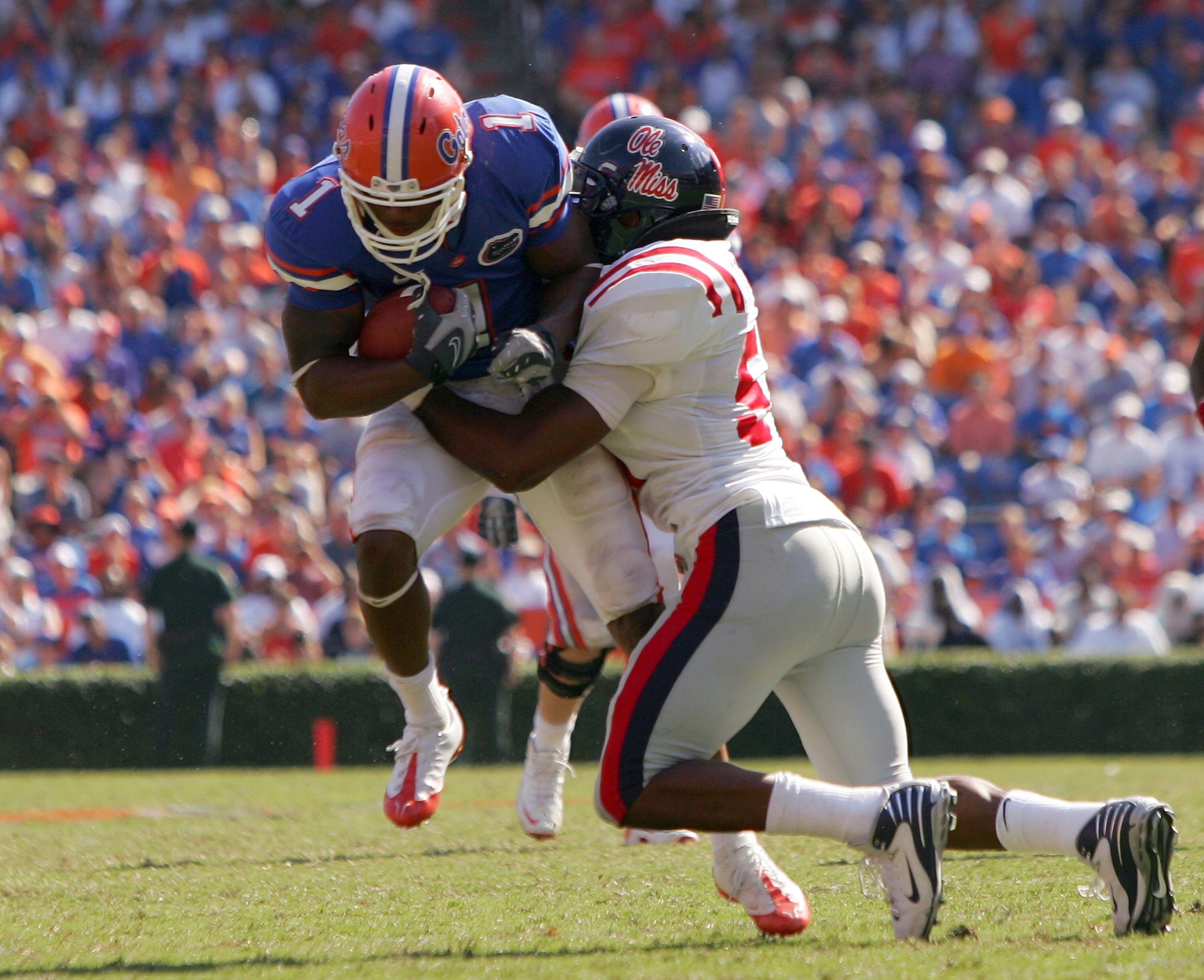 GAINESVILLE, FL - SEPTEMBER 27: Percy Harvin #1 of the Florida Gators is tackled by #52 Chris Bowers of the Ole Miss Rebels during the game at Ben Hill Griffin Stadium on September 27, 2008 in Gainesville, Florida. (Photo by Sam Greenwood/Getty Images) GAINESVILLE, FL - SEPTEMBER 27: Percy Harvin #1 of the Florida Gators is tackled by #52 Chris Bowers of the Ole Miss Rebels during the game at Ben Hill Griffin Stadium on September 27, 2008 in Gainesville, Florida. (Photo by Sam Greenwood/Getty Images)