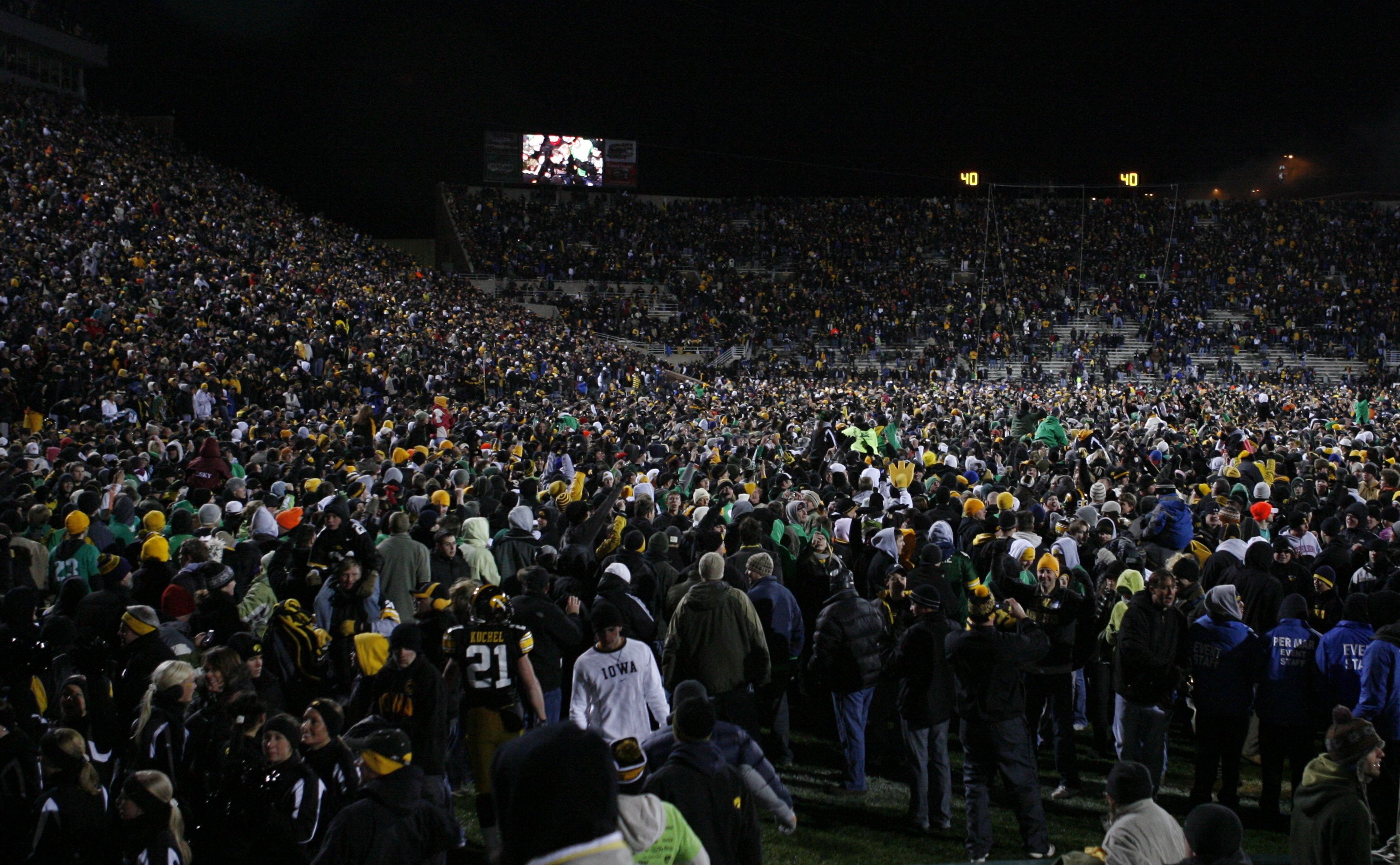 IOWA CITY, IOWA - NOVEMBER 8: Iowa Hawkeyes fans rush the field and celebrate as their team upset the Penn State Nittany Lions by kicking a field goal with six seconds left on the clock at Kinnick Stadium on November 8, 2008 in Iowa City, Iowa. Iowa defea