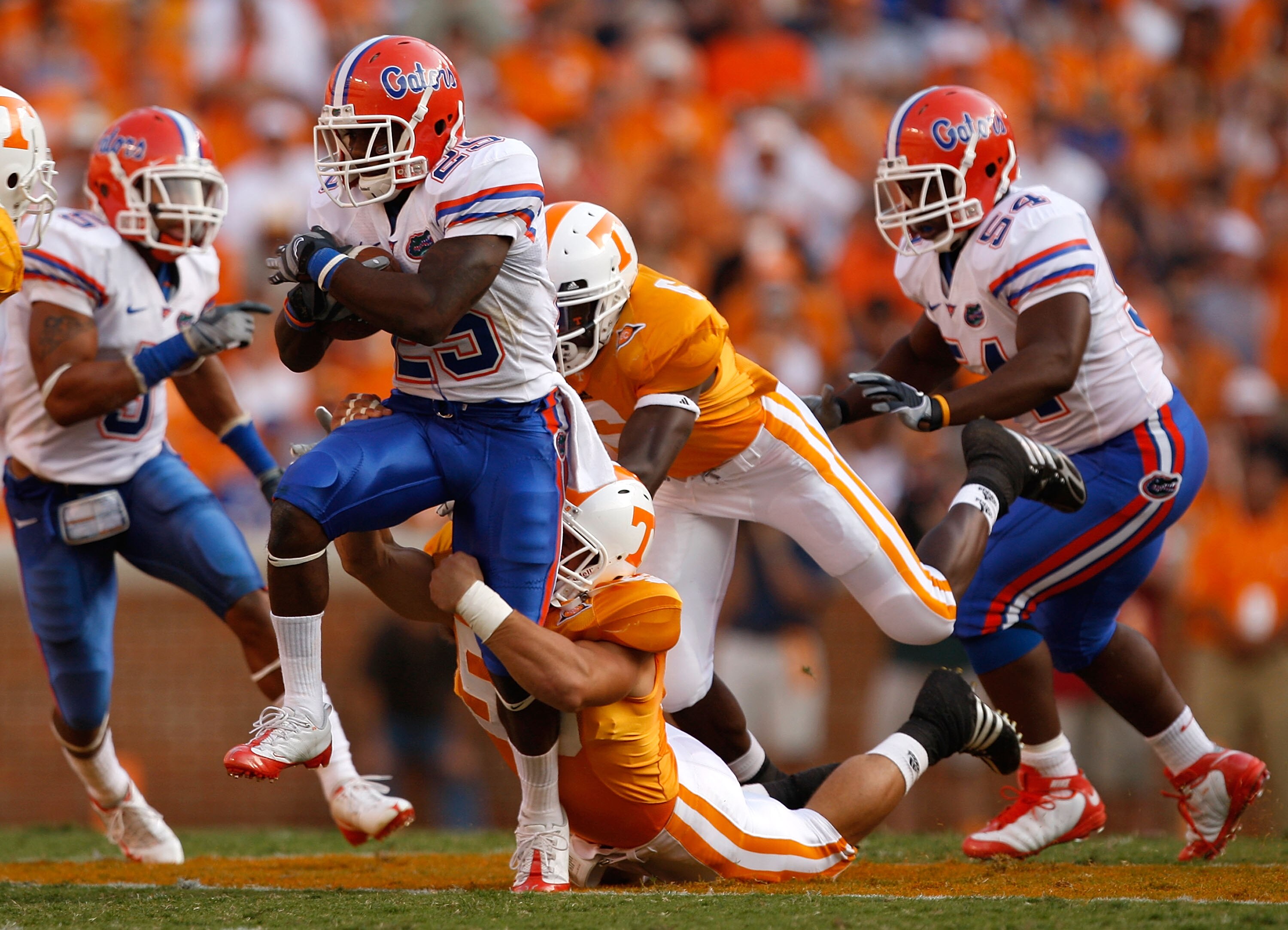 KNOXVILLE, TN - SEPTEMBER 20:  Brandon James #25 of the Florida Gators is tackled from behind by Nick Reveiz #56 of the Tennessee Volunteers during their game at Neyland Stadium on September 20, 2008 in Knoxville, Tennessee.  (Photo by Streeter Lecka/Gett