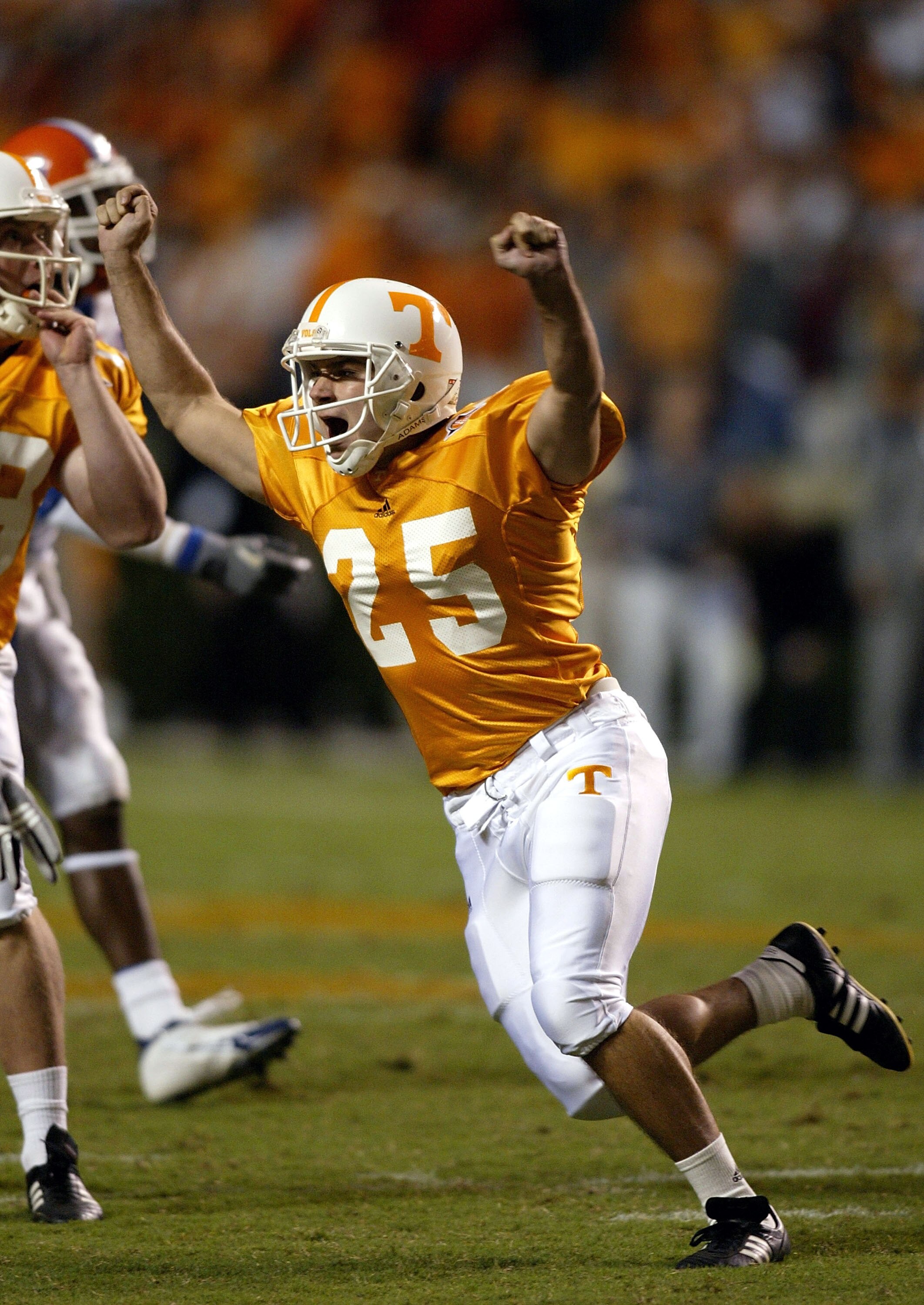KNOXVILLE, TN - SEPTEMBER 18:  James Wilhoit #25 of the Tennessee Volunteers celebrates after kicking a 50 yard field goal to win the game 30-28 over the Florida Gators at Neyland Stadium on September 18, 2004 in Knoxville, Tennessee.  (Photo by Streeter 