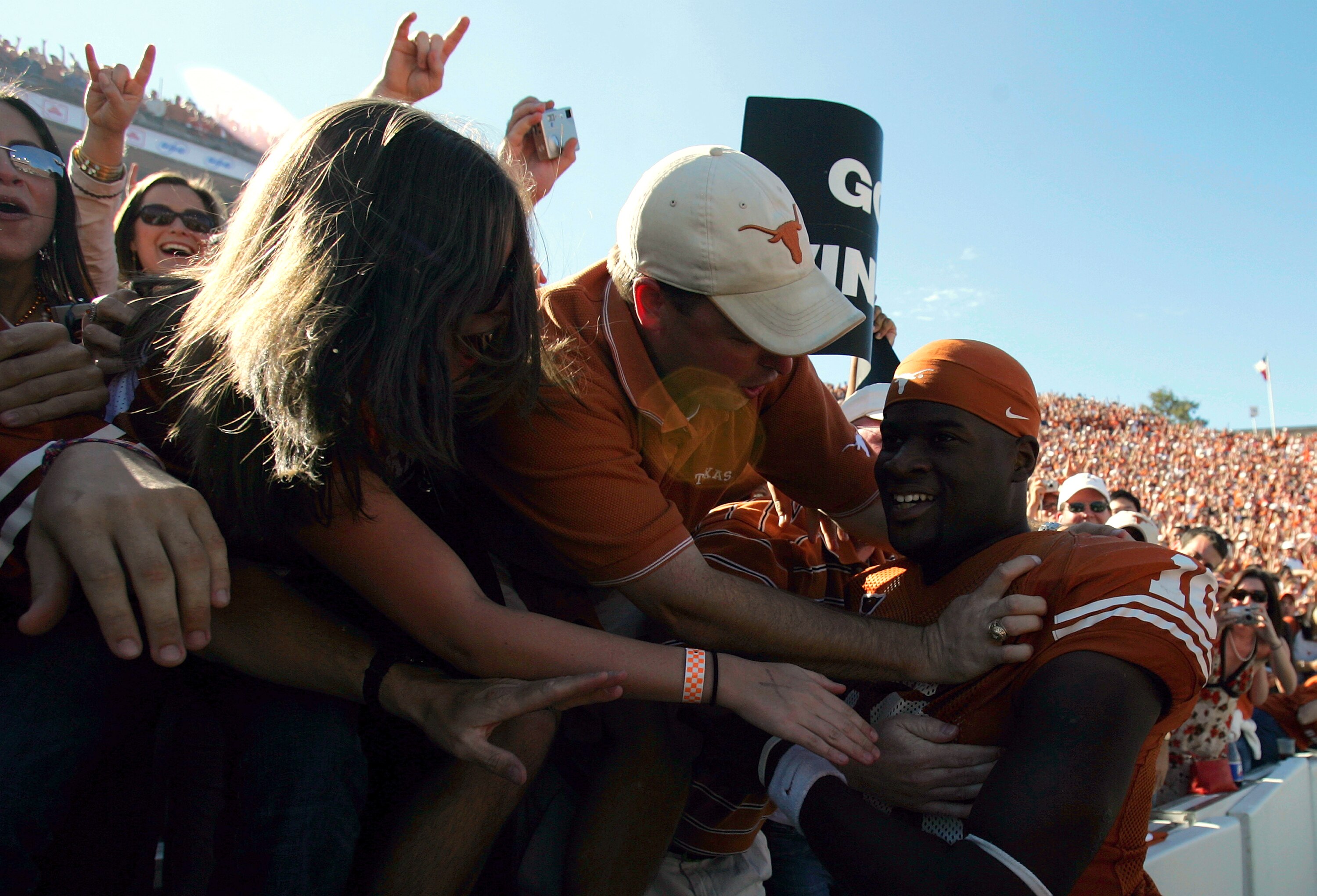 DALLAS - OCTOBER 8:  Quarterback Vince Young #10 of the Texas Longhorns celebrates a 45-12 win against the Oklahoma Sooners on October 8, 2005 at the Cotton Bowl in Dallas, Texas. The Longhorns defeated the Sooners 45-12.  (Photo by Ronald Martinez/Getty