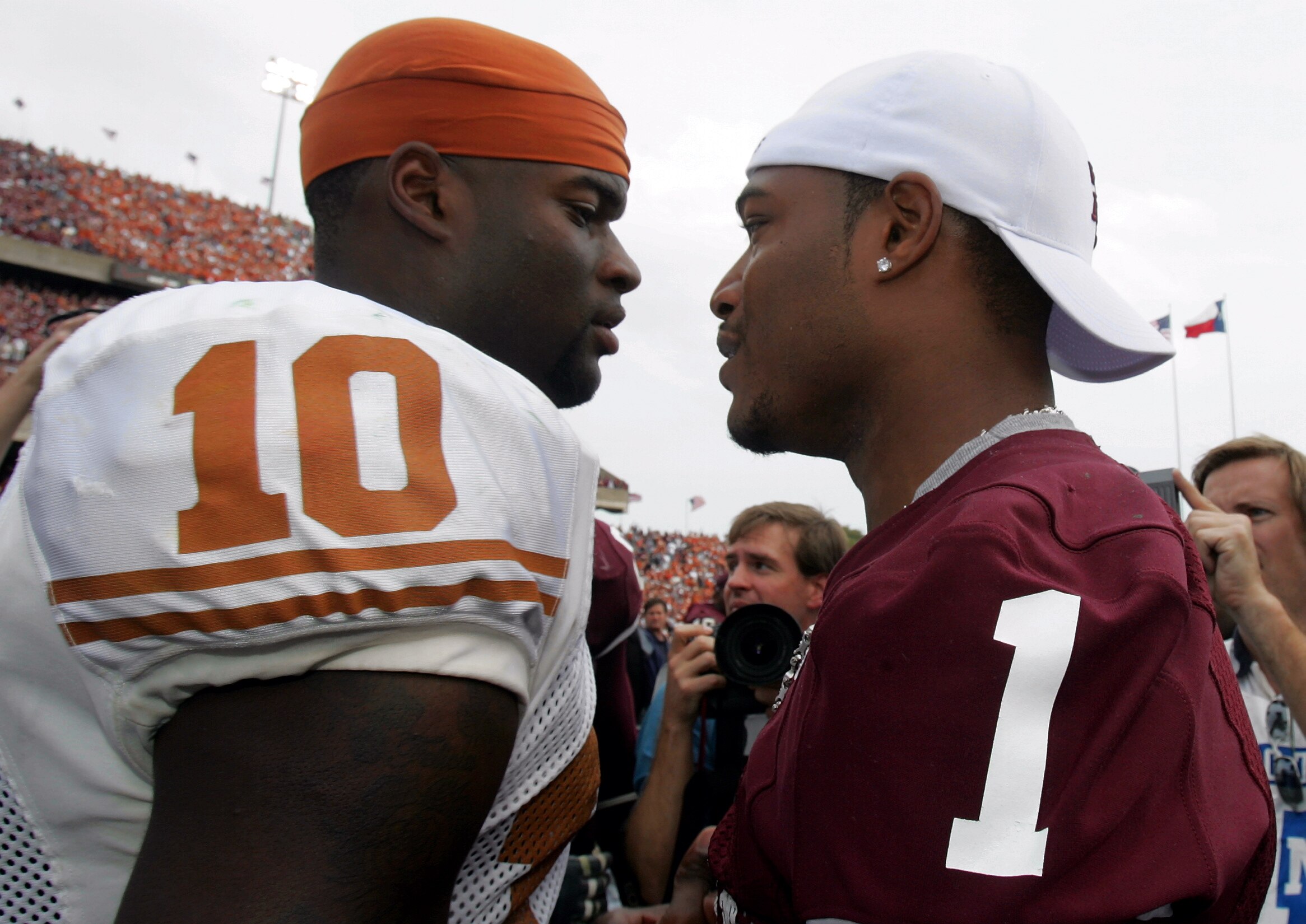 COLLEGE STATION, TX - NOVEMBER 25:  Quarterback Vince Young #10 of the Texas Longhorns meets with Reggie McNeal #1 of the Texas A&M Aggies at the end of the game on November 25, 2005 at Kyle Field in College Station, Texas.  The Longhorns defeated the Agg