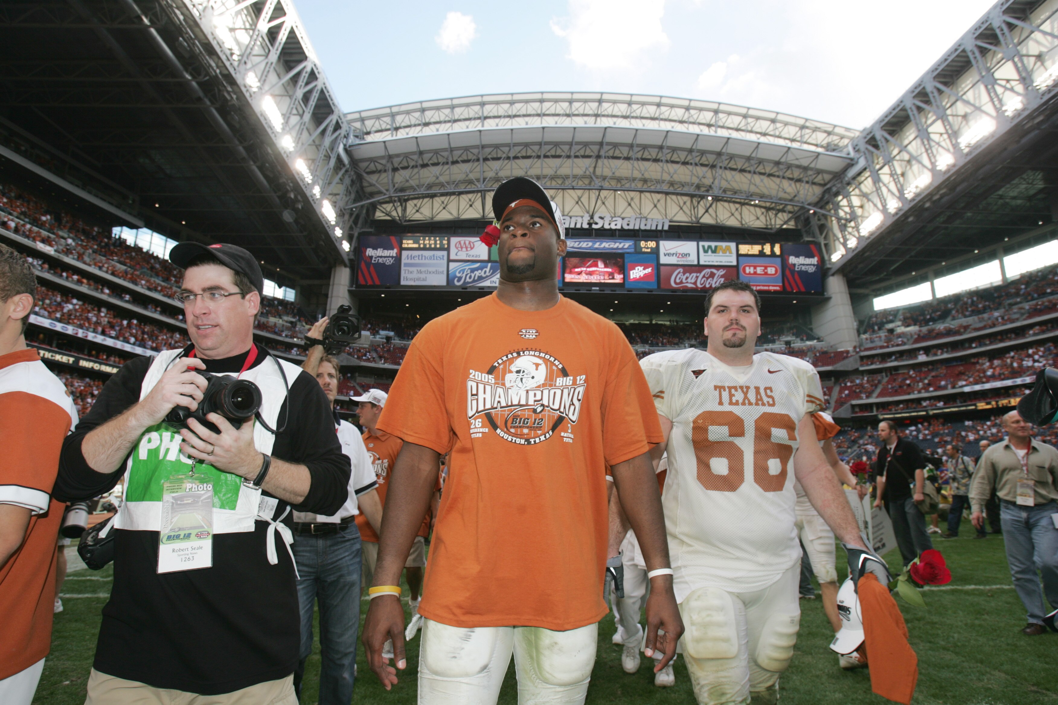 HOUSTON - DECEMBER 3:  Quarterback Vince Young #10 and center Brett Valdez #66 of the Texas Longhorns walk off the field following the Dr. Pepper Big 12 Championship against the Colorado Buffaloes at Reliant Stadium on December 3, 2005  in Houston, Texas.