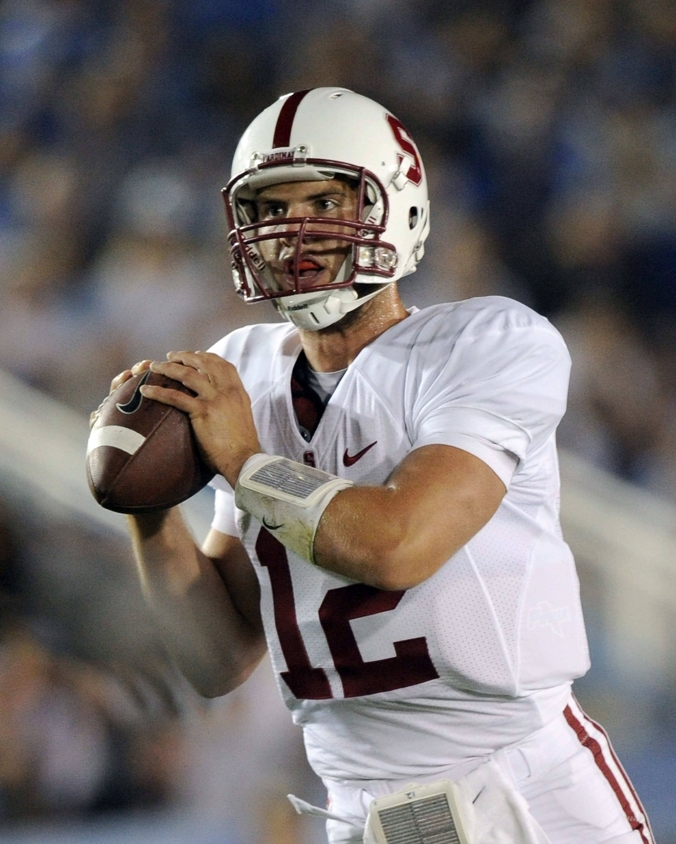 PASADENA, CA - SEPTEMBER 11:  Andrew Luck #12 of Stanford passes in the pocket against UCLA during the game at the Rose Bowl on September 11, 2010 in Pasadena, California.  (Photo by Harry How/Getty Images)
