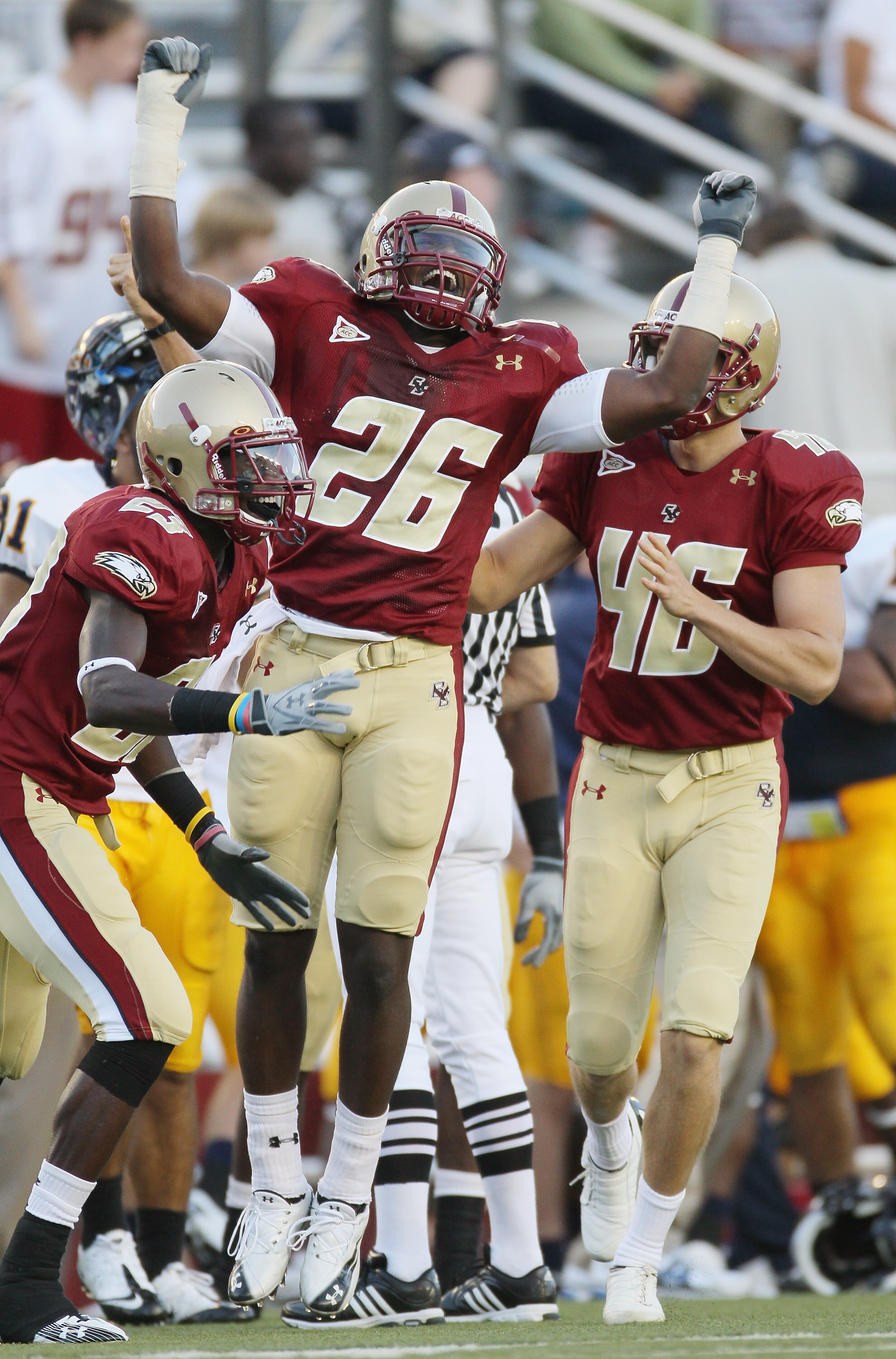 CHESTNUT HILL, MA - SEPTEMBER 11:  Dominick LeGrande #26 of the Boston College Eagles celebrates with teammates Jim Noel #23 and Ryan Quigley #46 after LeGrande recovered a fumble in the second half  the Kent State Golden Flashes on September 11, 2010 at