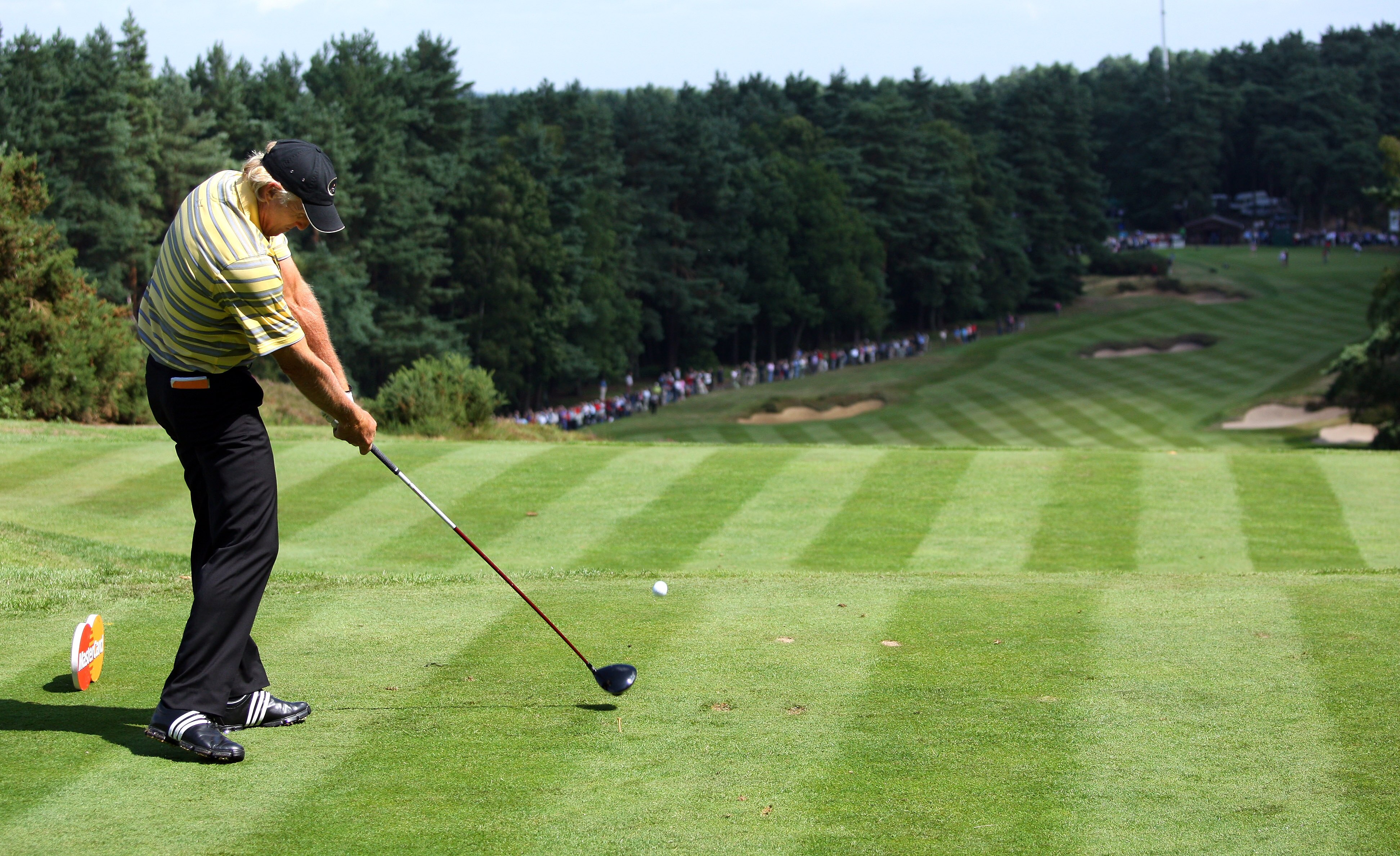 SUNNINGDALE, ENGLAND - JULY 23:  Greg Norman of Australia hits his tee-shot on the tenth hole during the first round of The Senior Open Championship presented by MasterCard held on the Old Course at Sunningdale Golf Club on July 23, 2009 in Sunningdale, E