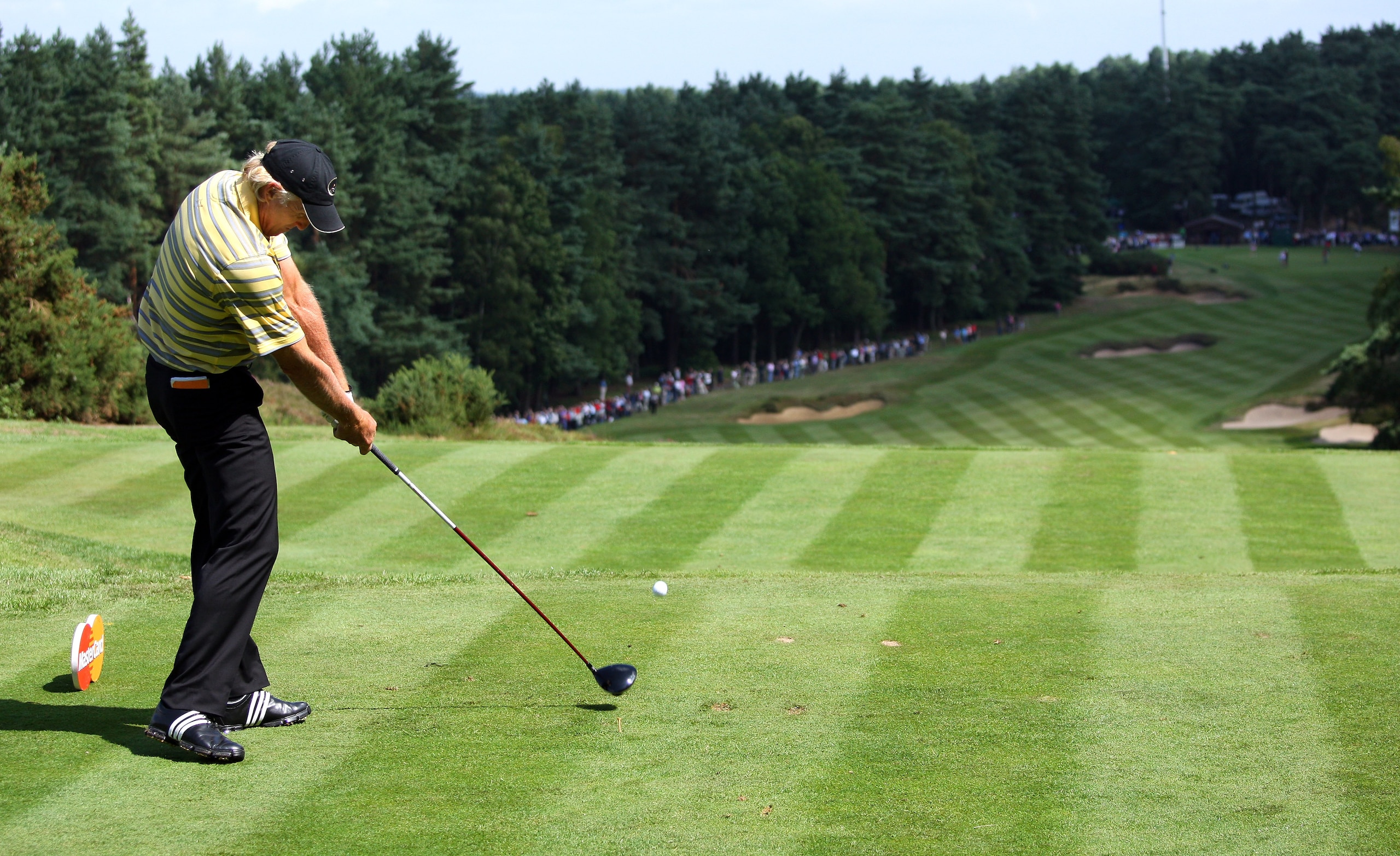 SUNNINGDALE, ENGLAND - JULY 23:  Greg Norman of Australia hits his tee-shot on the tenth hole during the first round of The Senior Open Championship presented by MasterCard held on the Old Course at Sunningdale Golf Club on July 23, 2009 in Sunningdale, E