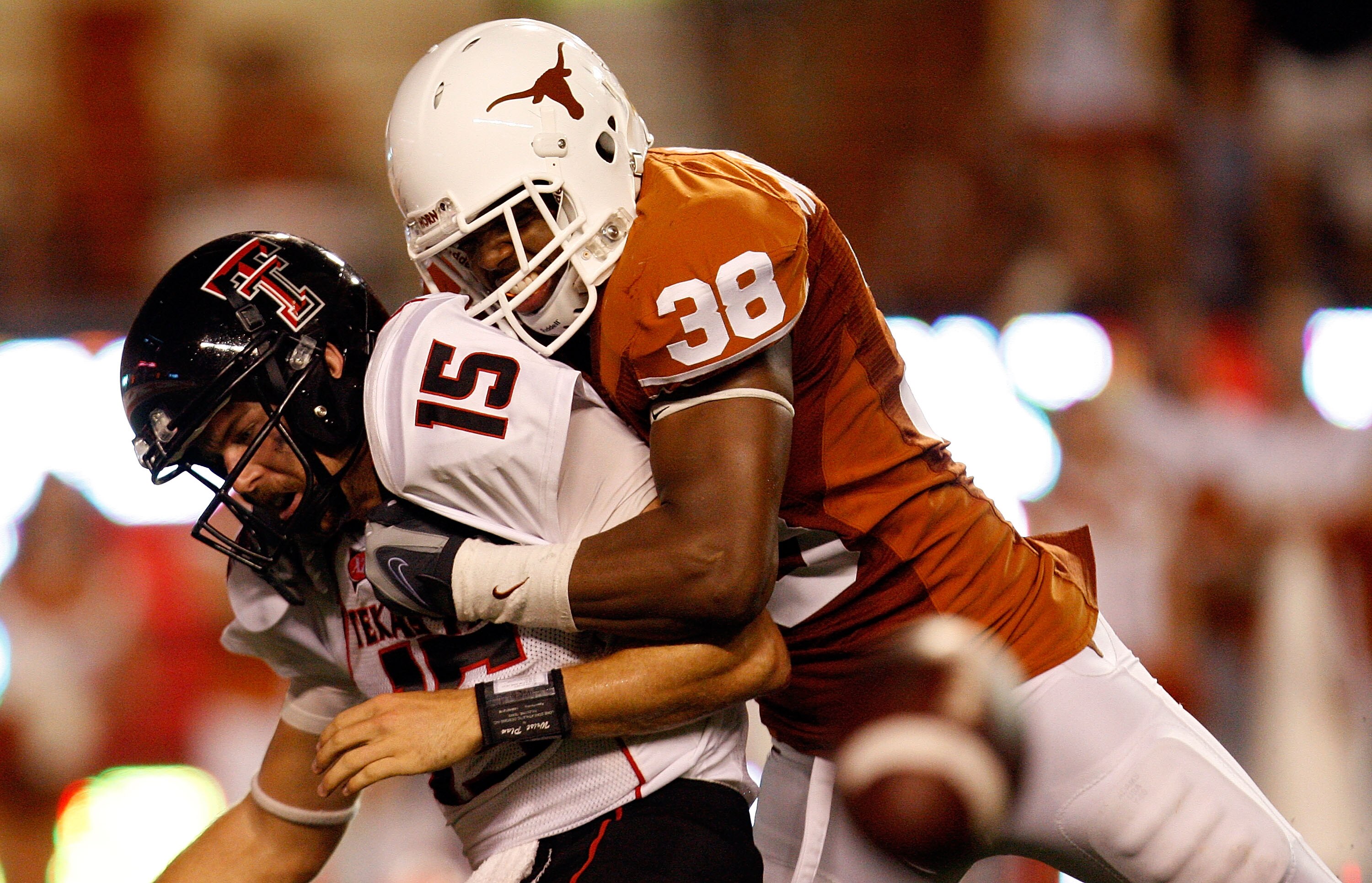 AUSTIN, TX - SEPTEMBER 19:  Quarterback Taylor Potts #15 of the Texas Tech Red Raiders is sacked by Roddrick Muckelroy #38 of the Texas Longhorns at Darrell K Royal-Texas Memorial Stadium on September 19, 2009 in Austin, Texas.  (Photo by Ronald Martinez/