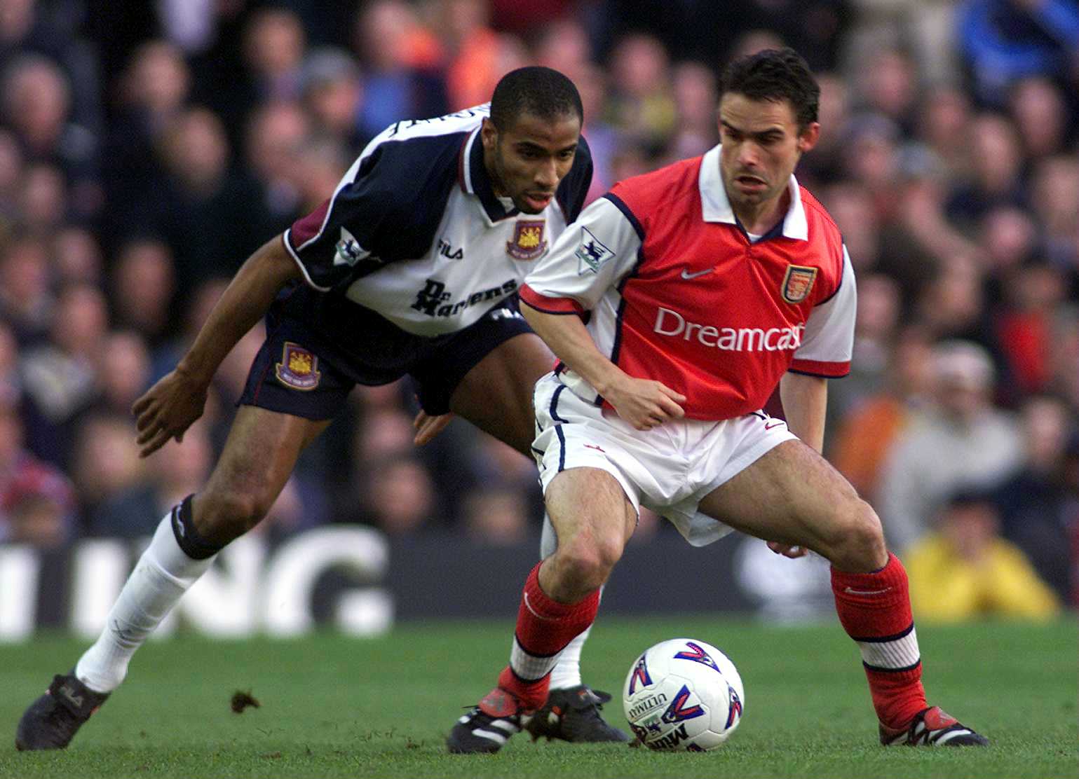 2 May 2000:  Marc Overmars of Arsenal takes on Frederic Kanoute of West Ham during the match between Arsenal and West Ham United in the FA Carling Premiership at Highbury, London.  Mandatory Credit: Laurence Griffiths/ALLSPORT