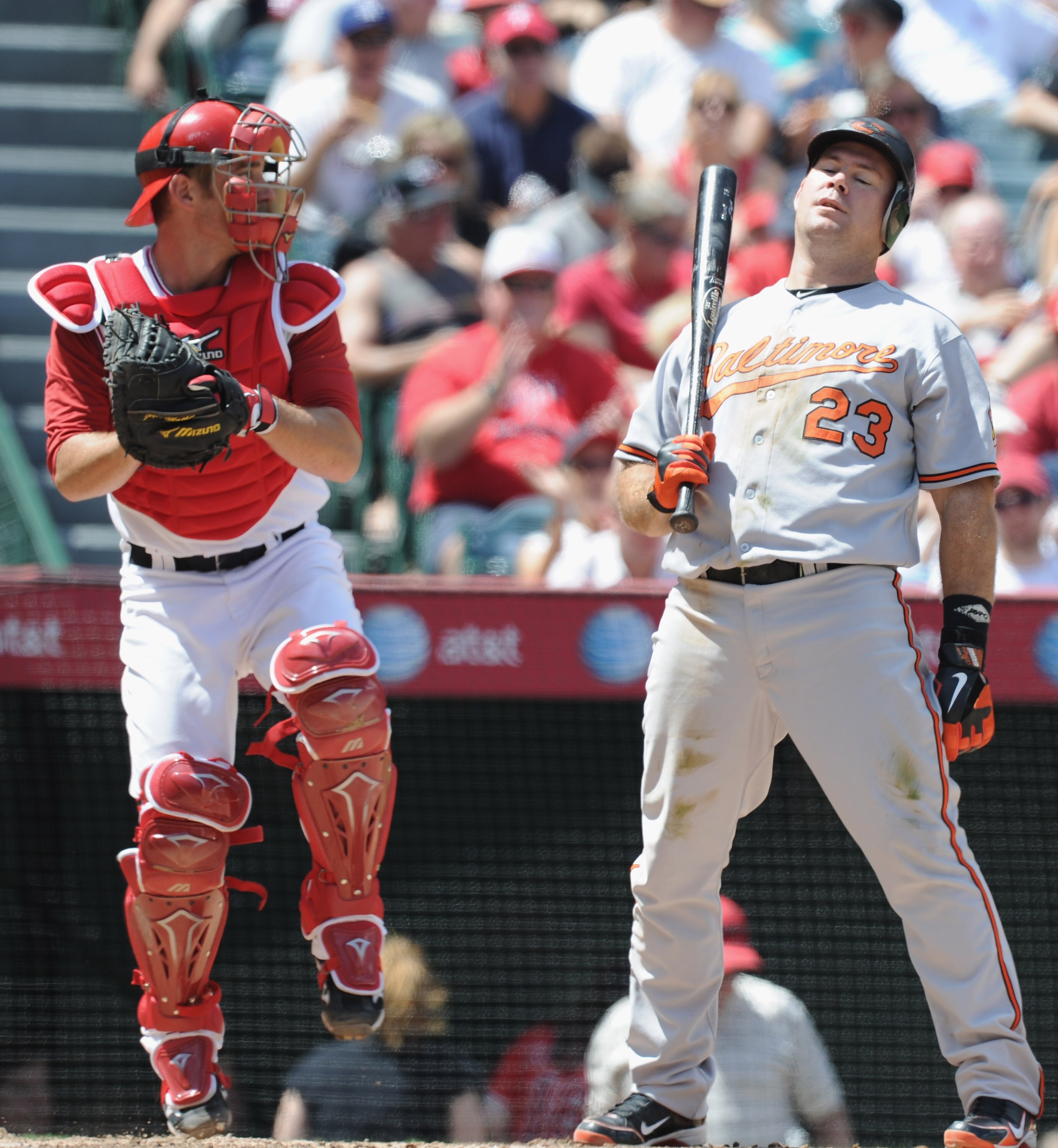 ANAHEIM, CA - AUGUST 29:  Ty Wigginton #23 of the Baltimore Orioles reacts to his strikeout in front of Jeff Mathis #5 of the Los Angeles Angels of Anaheim at Angel Stadium on August 29, 2010 in Anaheim, California.  (Photo by Harry How/Getty Images)