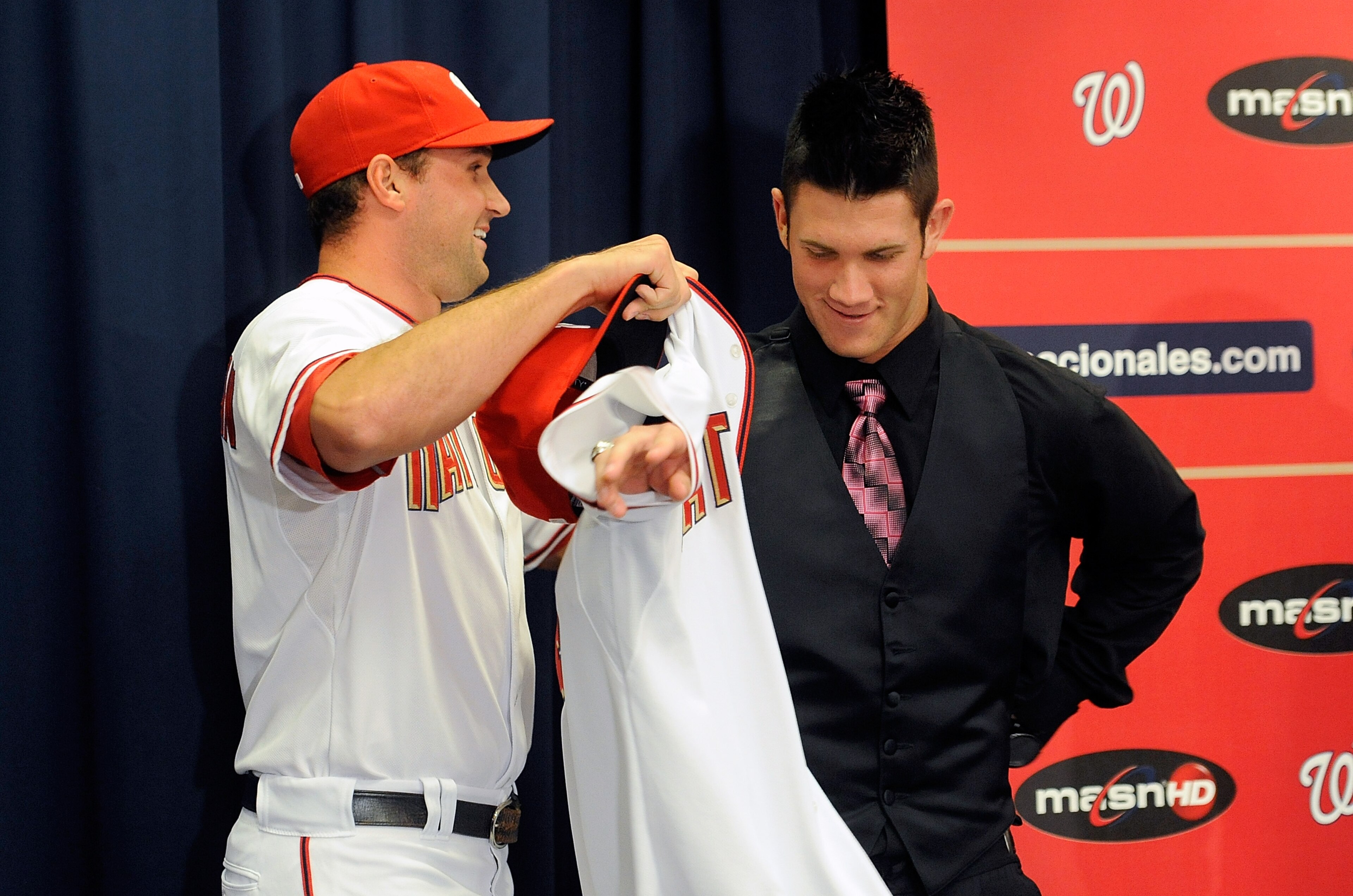 WASHINGTON - AUGUST 26:  Ryan Zimmerman #11 of the Washington Nationals presents Bryce Harper #34 with his jersey during a press conference at Nationals Park on August 26, 2010 in Washington, DC.  (Photo by Greg Fiume/Getty Images)